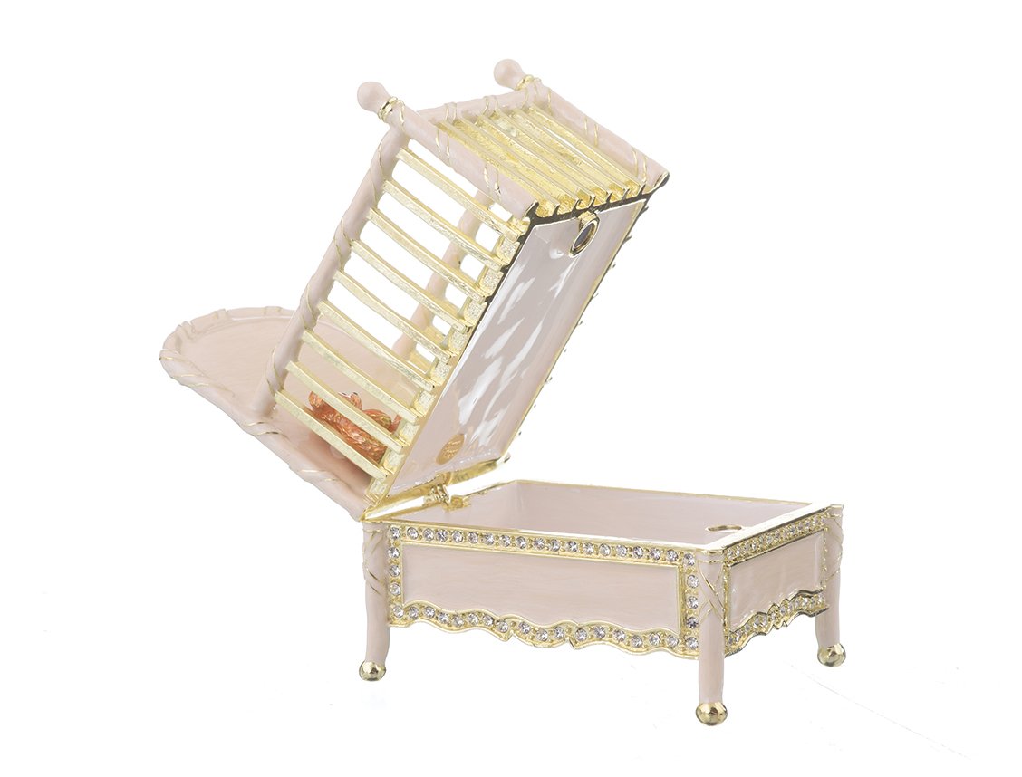 A beautifully crafted Pink Baby Bed trinket box, handmade with enamel and adorned with sparkling Austrian crystals, featuring a luxurious gold or silver plating.