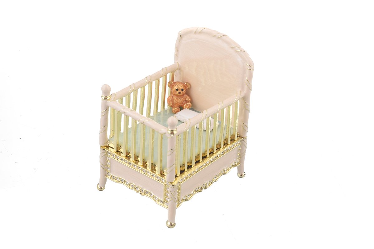 A beautifully crafted Pink Baby Bed trinket box, handmade with enamel and adorned with sparkling Austrian crystals, featuring a luxurious gold or silver plating.