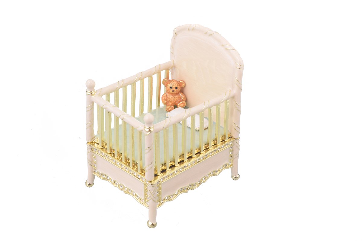 A beautifully crafted Pink Baby Bed trinket box, handmade with enamel and adorned with sparkling Austrian crystals, featuring a luxurious gold or silver plating.