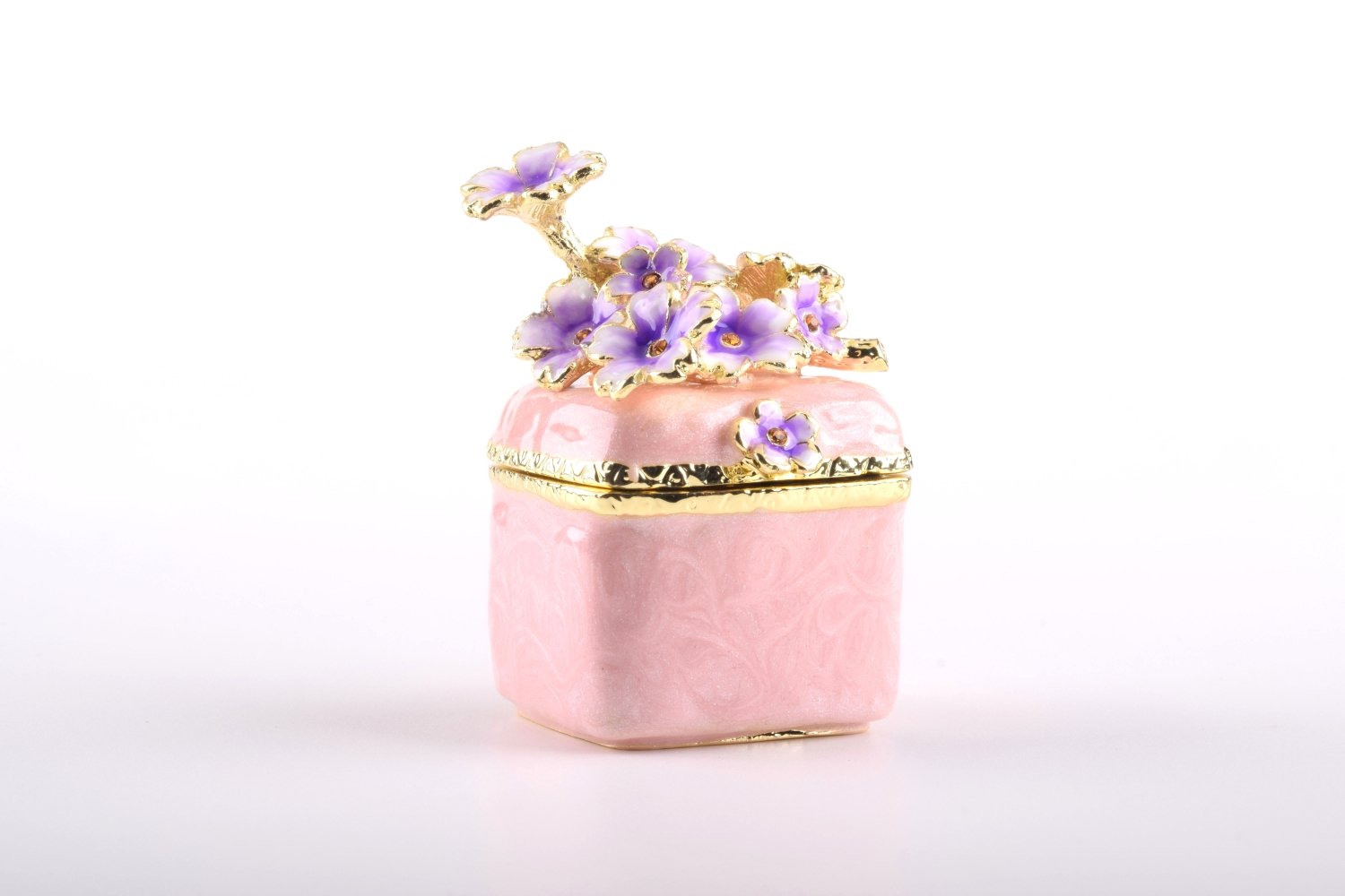 A beautiful pink enamel trinket box adorned with sparkling Austrian crystals and plated with 24K gold, showcasing exquisite craftsmanship.