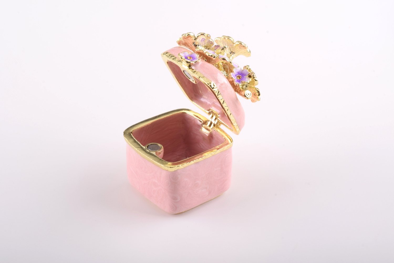 A beautiful pink enamel trinket box adorned with sparkling Austrian crystals and plated with 24K gold, showcasing exquisite craftsmanship.