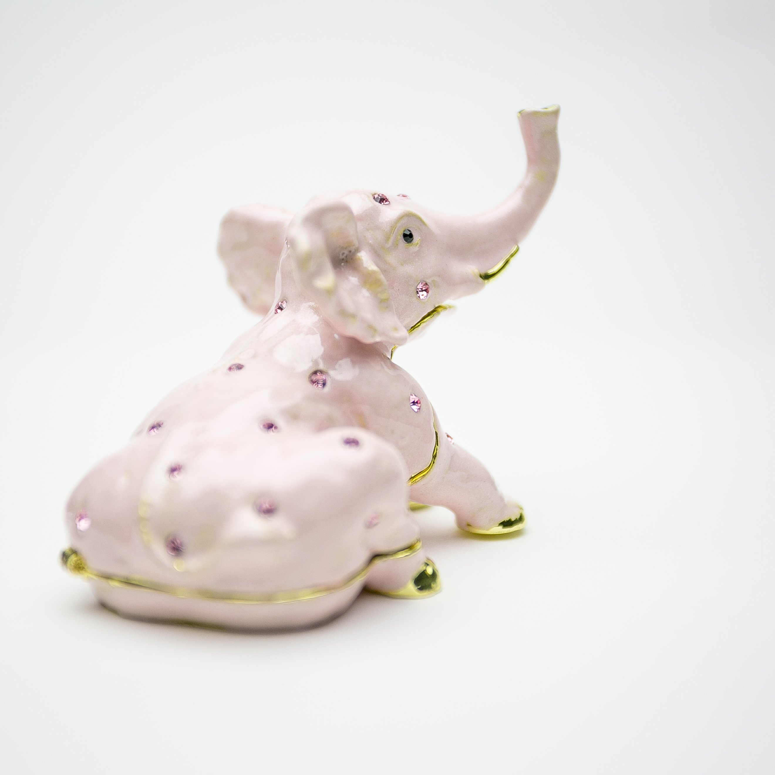 Handcrafted Pink Elephant trinket box adorned with Austrian crystals and plated in 24K gold, showcasing intricate details and vibrant colors.