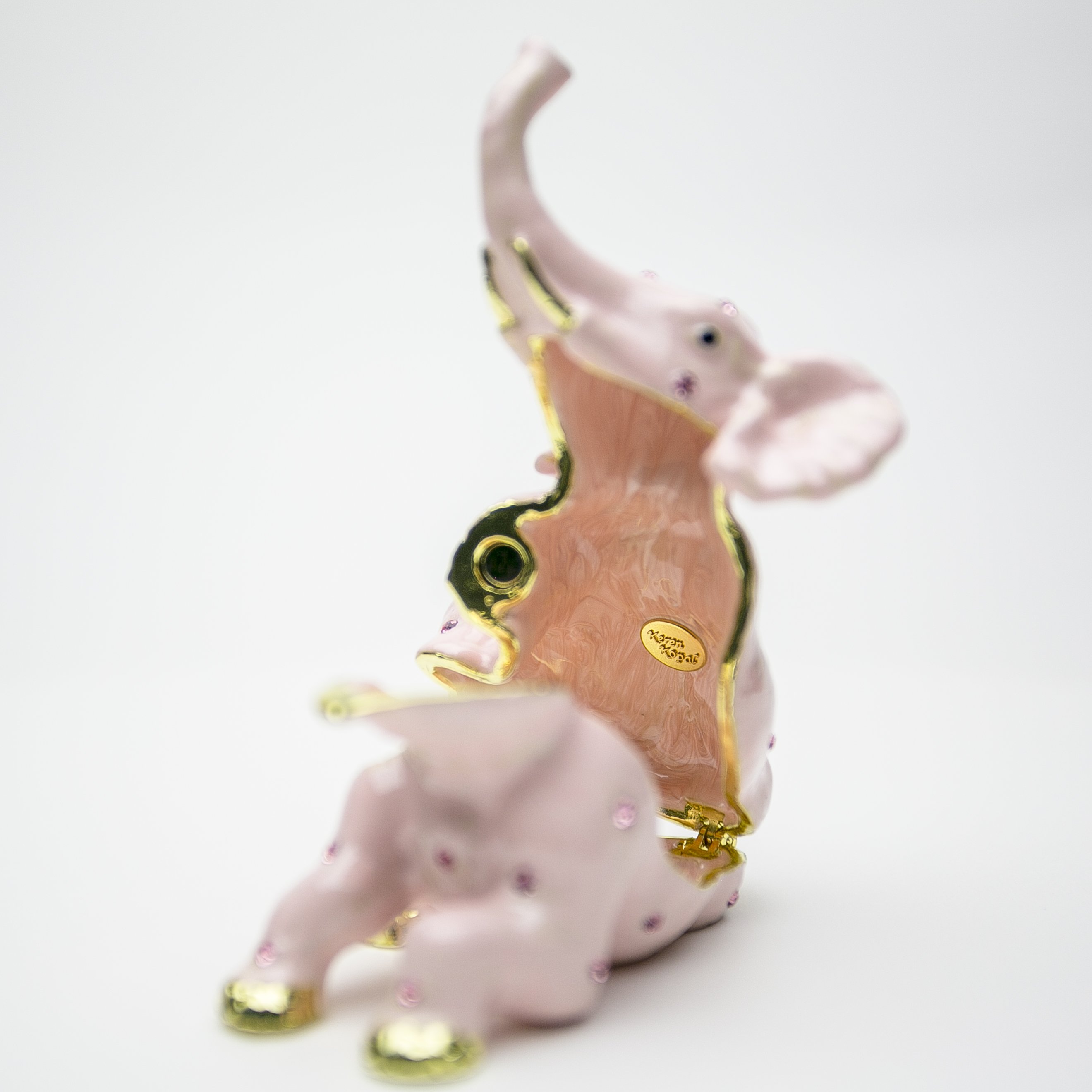 Handcrafted Pink Elephant trinket box adorned with Austrian crystals and plated in 24K gold, showcasing intricate details and vibrant colors.