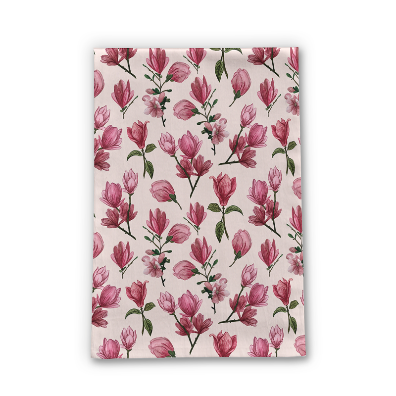 A vibrant Pink Magnolia Blossom Tea Towel featuring beautiful floral designs on a soft cotton twill fabric, perfect for kitchen decor.