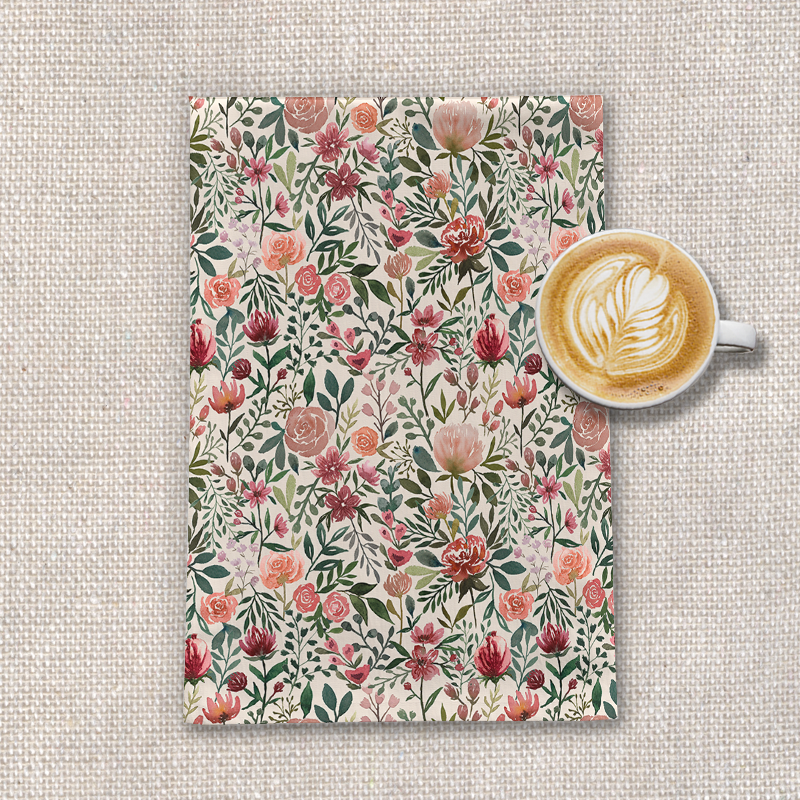 A vibrant pink tea towel featuring spring flowers, made from durable cotton twill, perfect for kitchen use.