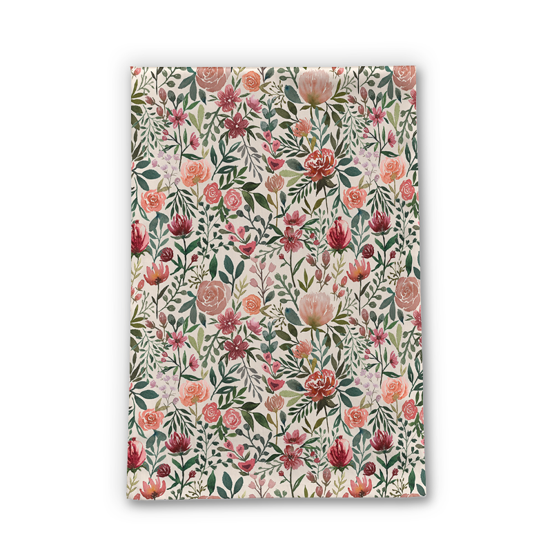 A vibrant pink tea towel featuring spring flowers, made from durable cotton twill, perfect for kitchen use.