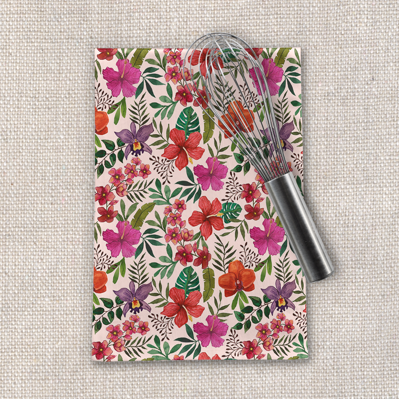 A vibrant pink tropical flower tea towel made of cotton twill, featuring a beautiful floral design, perfect for kitchen use.