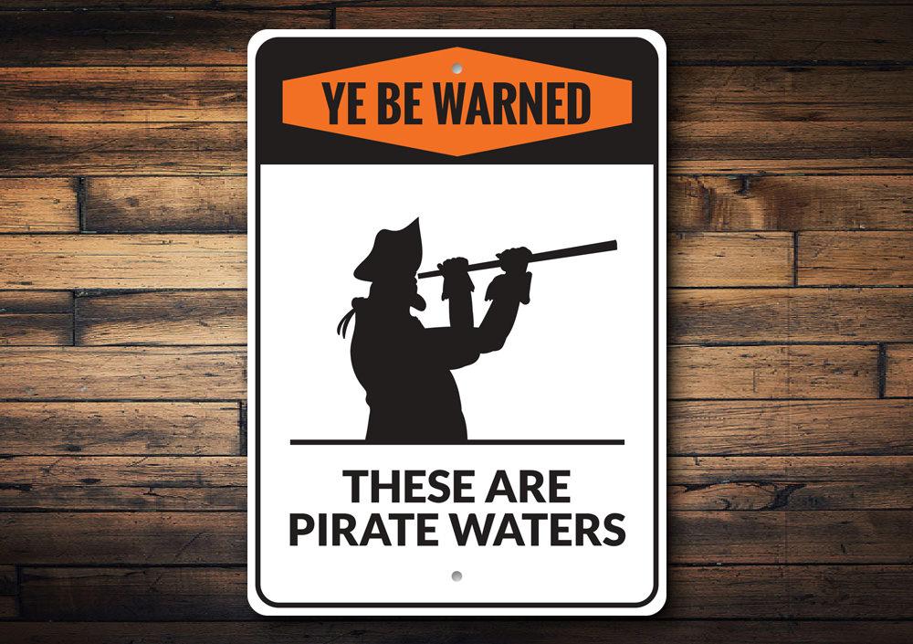 A decorative Pirate Sign made of high-quality aluminum, featuring customizable text, perfect for beach-themed decor.