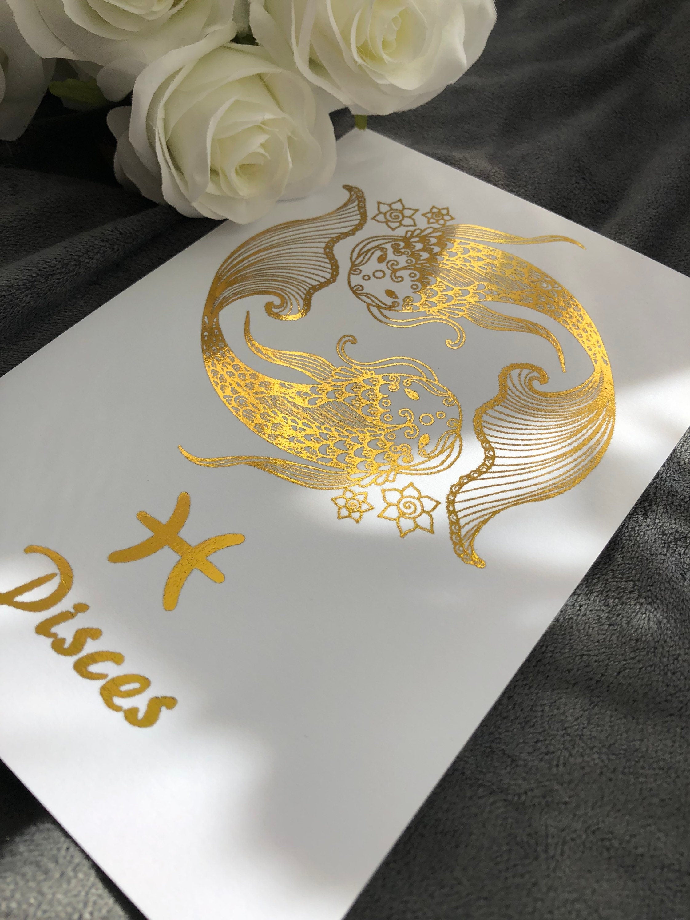 Pisces Star Sign Foil Print featuring two fish symbolizing the zodiac sign, elegantly designed with shimmering foil.