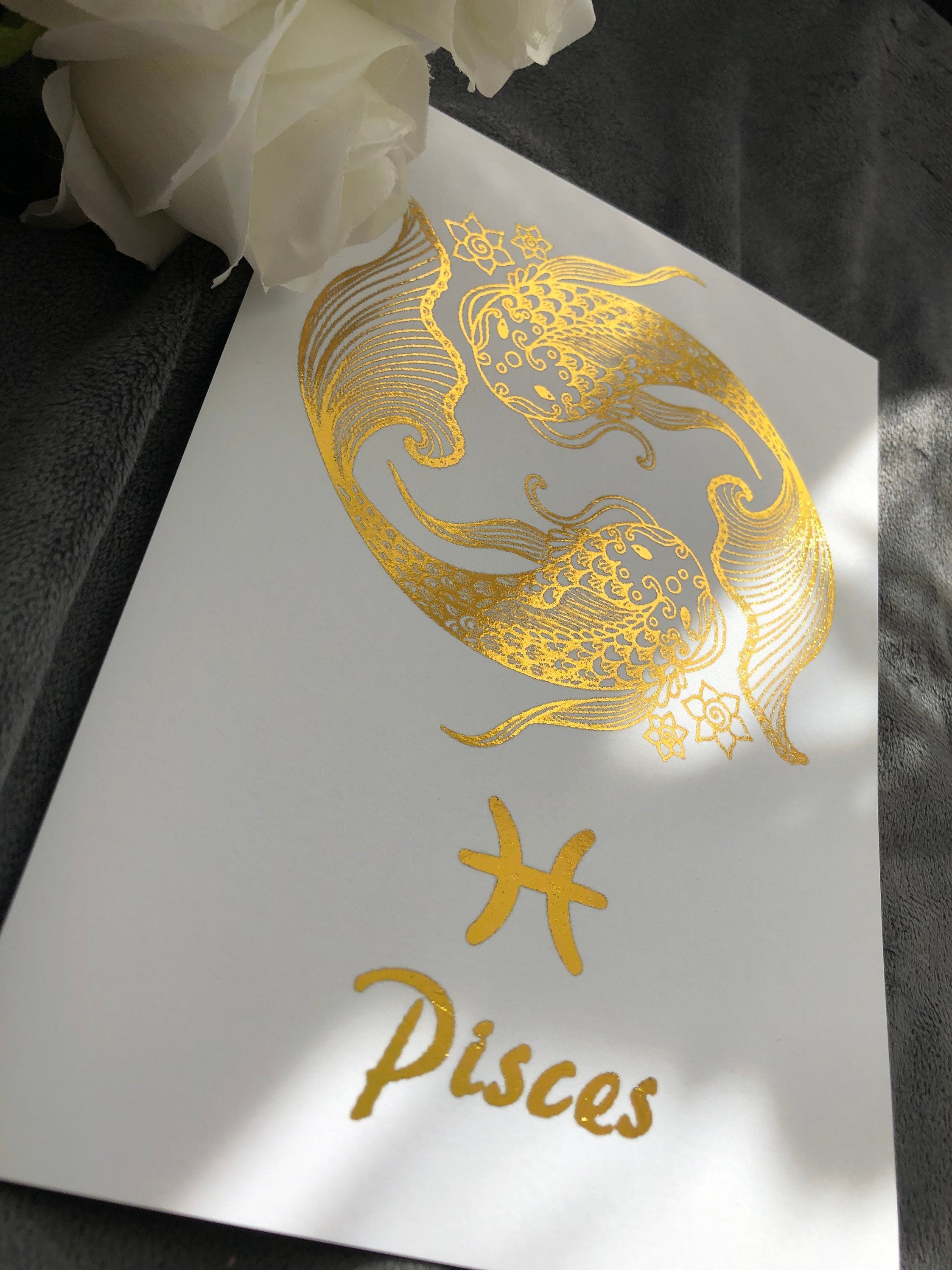 Pisces Star Sign Foil Print featuring two fish symbolizing the zodiac sign, elegantly designed with shimmering foil.