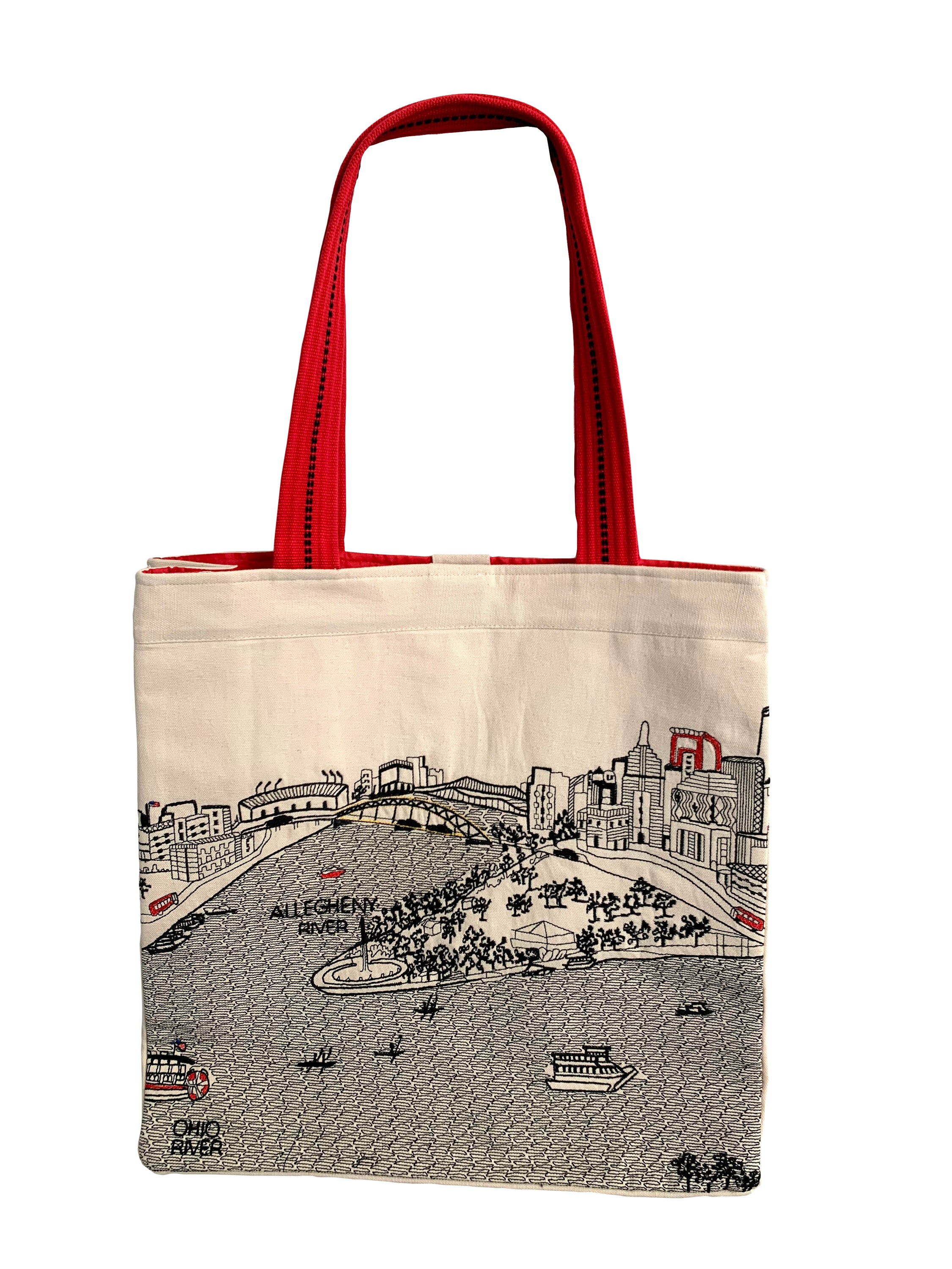 Pittsburgh Tote Bag featuring an embroidered skyline design, available in cream and black with red waterproof lining and straps.