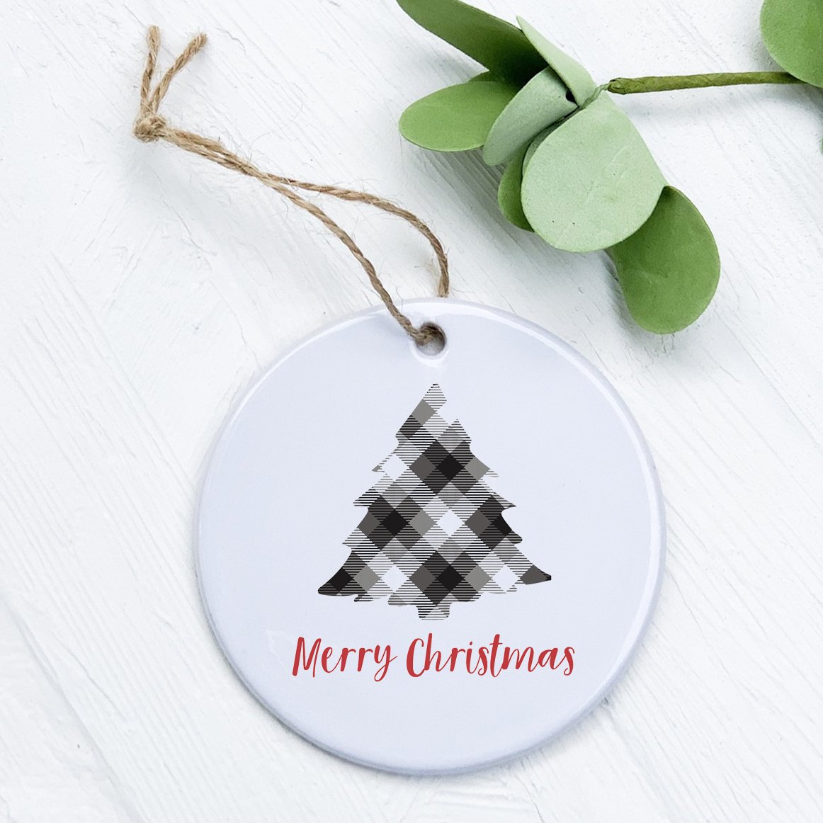 A beautifully crafted porcelain ornament featuring a plaid Christmas tree design, perfect for holiday decor and gifting.