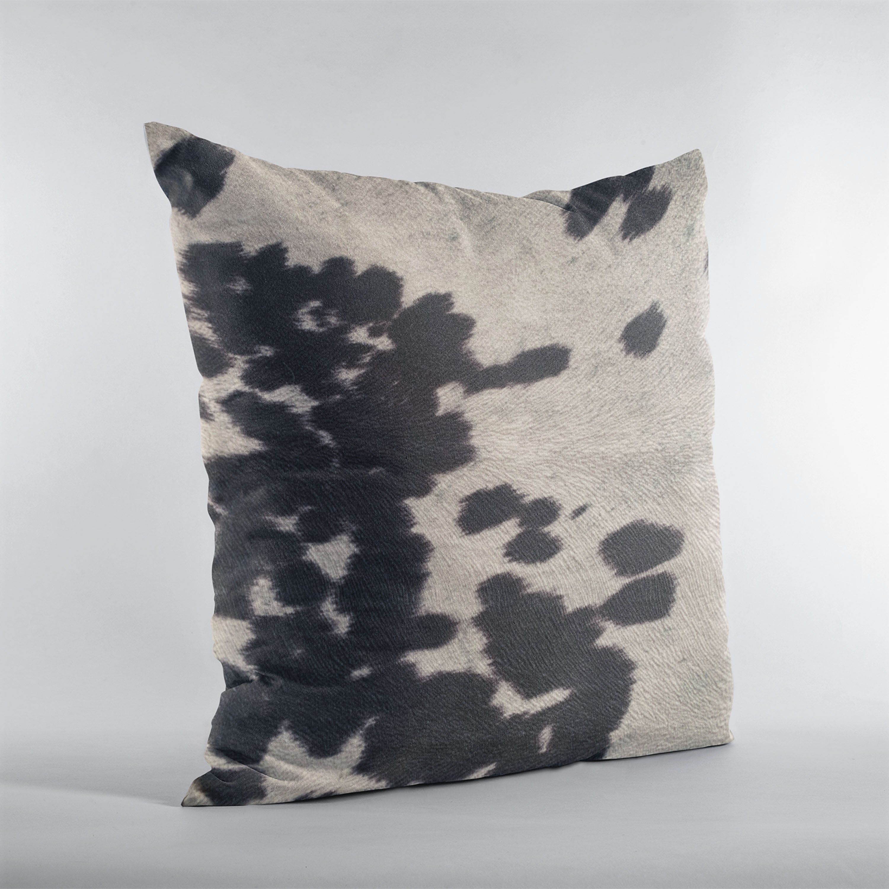 Plutus Black Cowhide Animal Luxury Throw Pillow featuring a sleek black design with a soft texture, perfect for home decor.