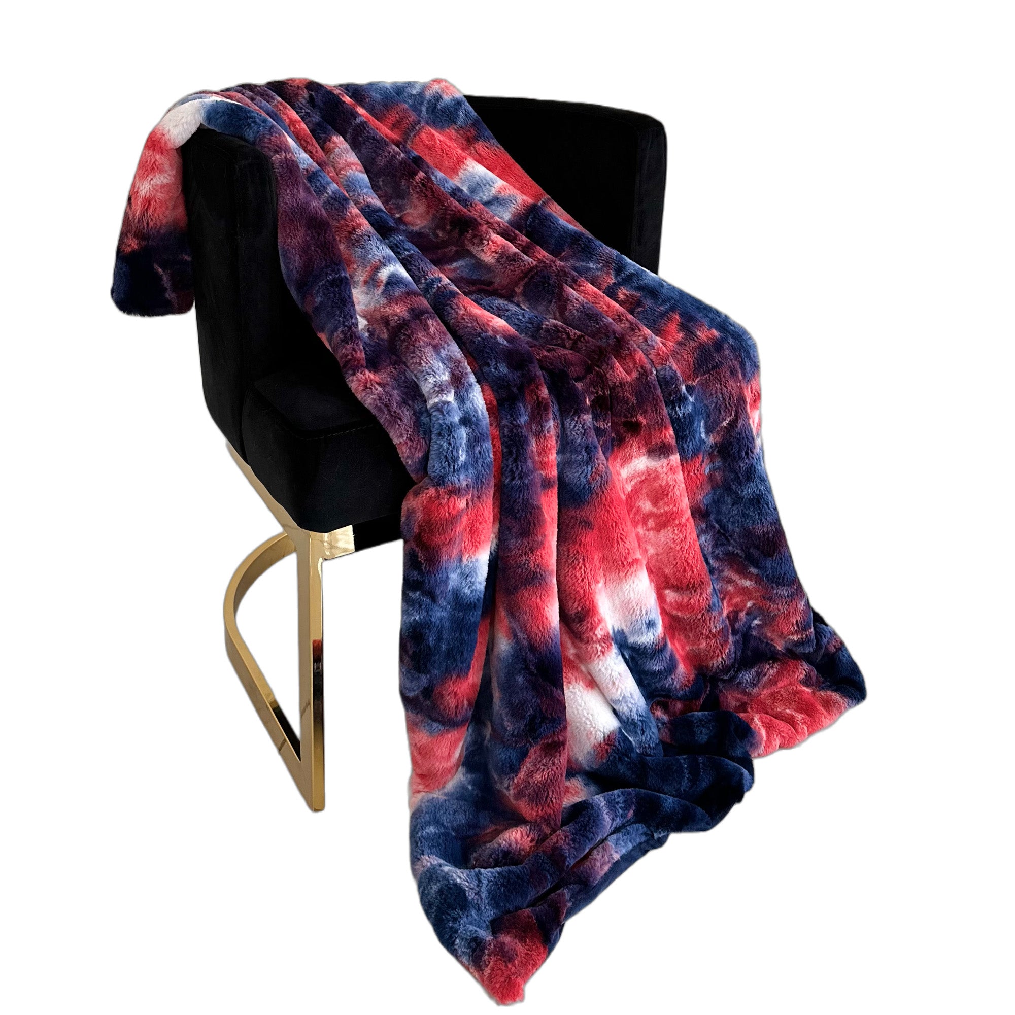 Plutus Blue Red White Faux Fur Luxury Throw Blanket draped elegantly over a sofa, showcasing its plush texture and vibrant colors.