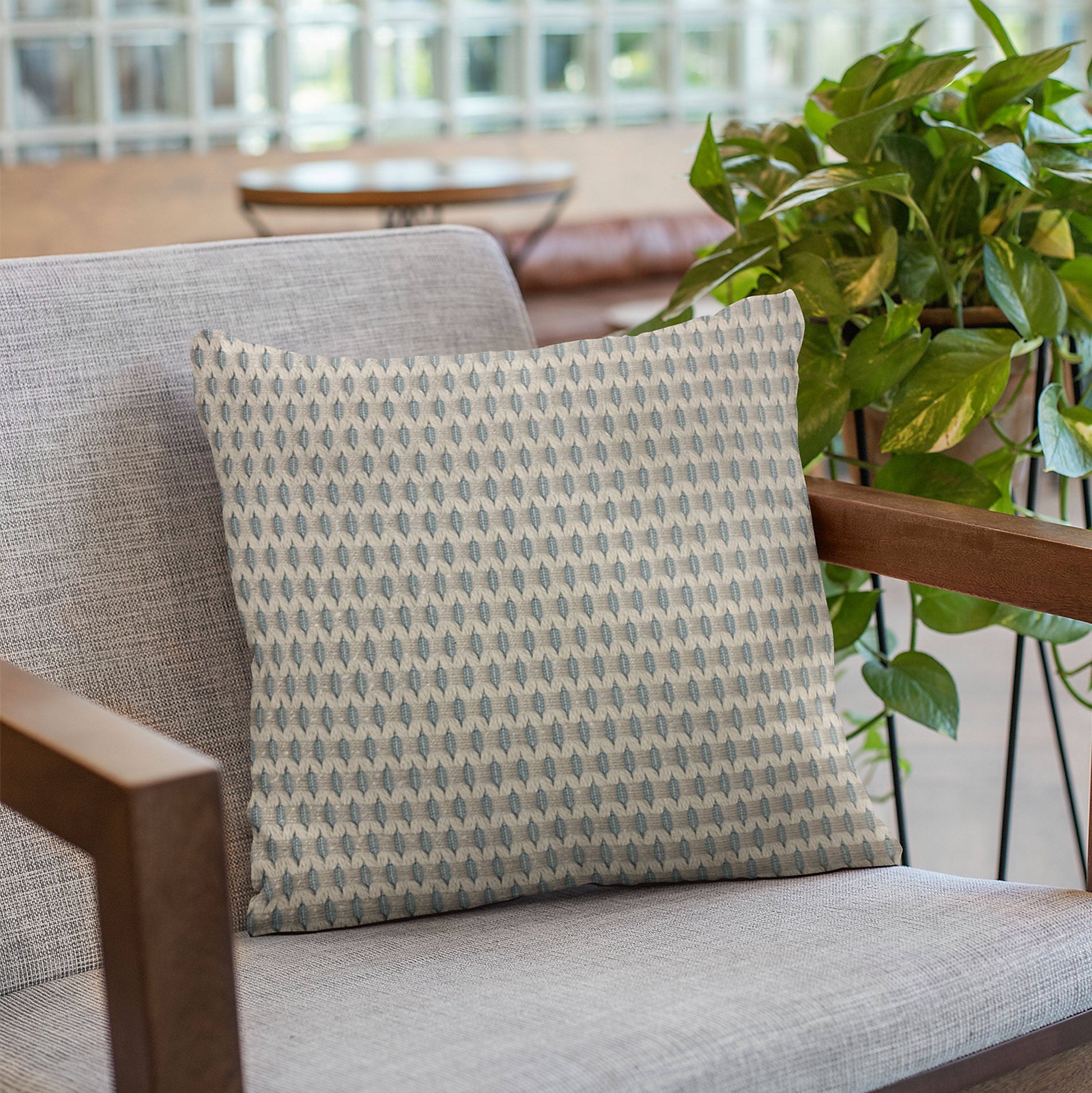 Plutus Blue Rocks Dot Luxury Throw Pillow featuring a trendy blue dot pattern, handmade in the USA with a hypoallergenic down alternative insert.