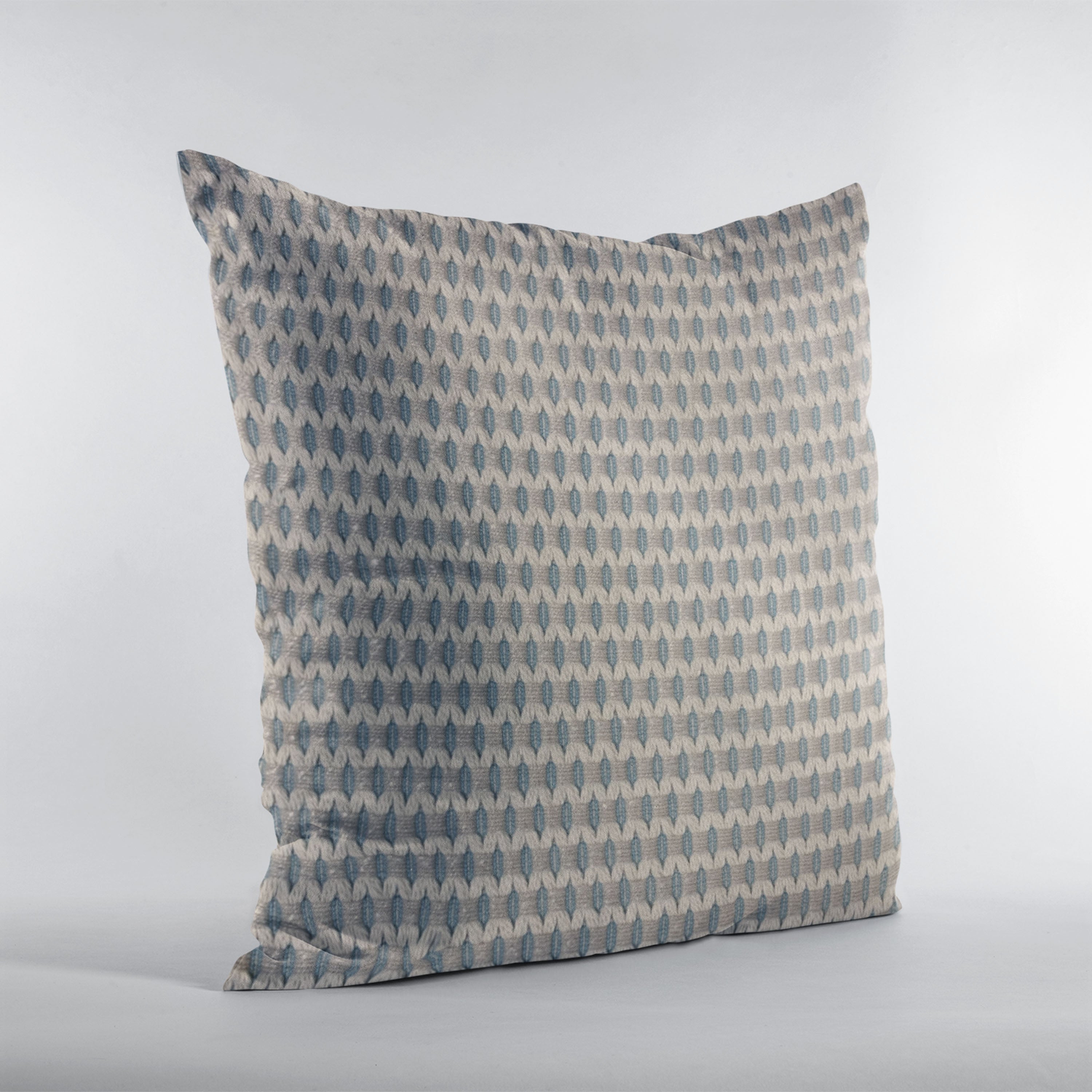 Plutus Blue Rocks Dot Luxury Throw Pillow featuring a trendy blue dot pattern, handmade in the USA with a hypoallergenic down alternative insert.