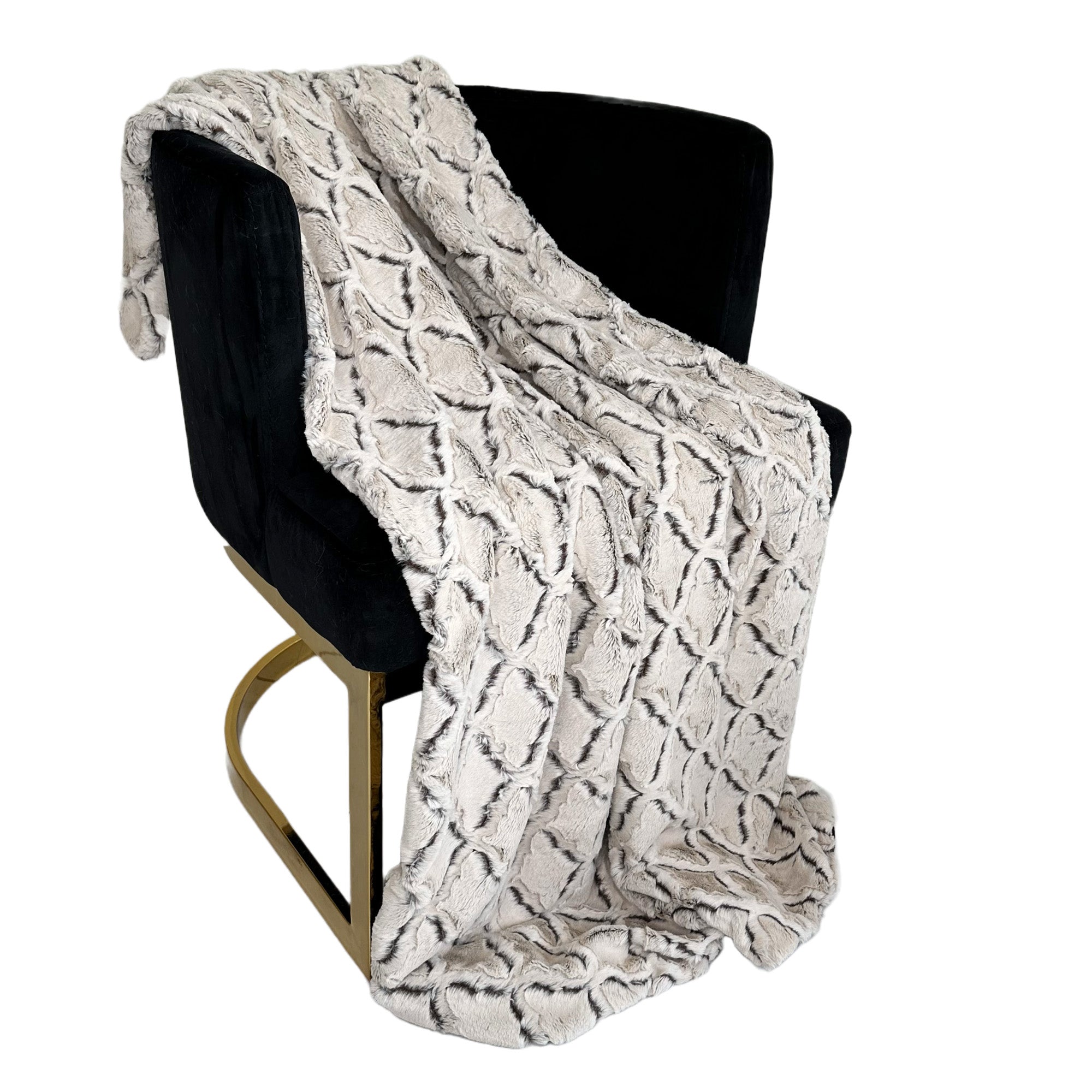 Plutus Brown Beige Diamond Faux Fur Luxury Throw Blanket draped elegantly on a couch, showcasing its soft texture and reversible design.