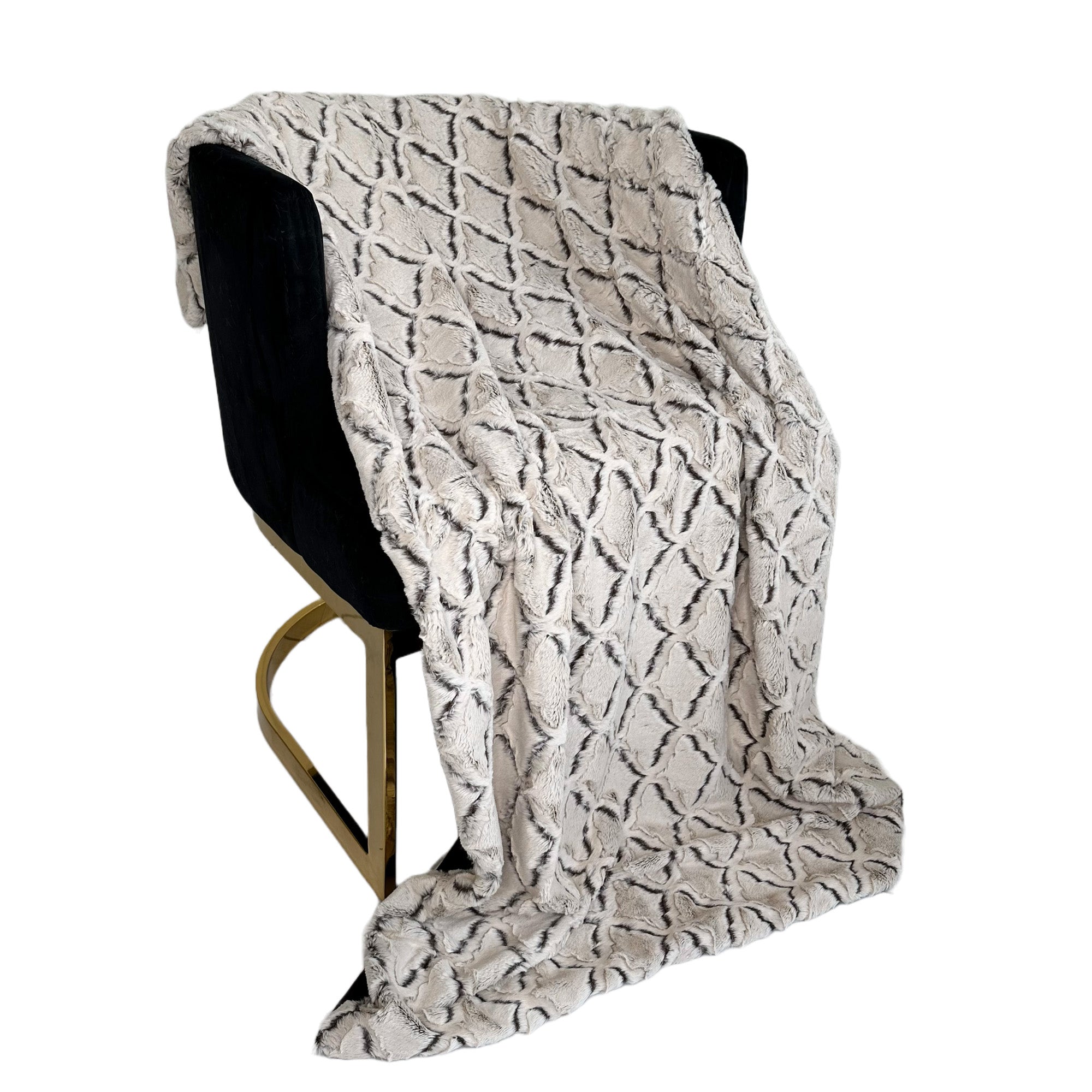 Plutus Brown Beige Diamond Faux Fur Luxury Throw Blanket draped elegantly on a couch, showcasing its soft texture and reversible design.