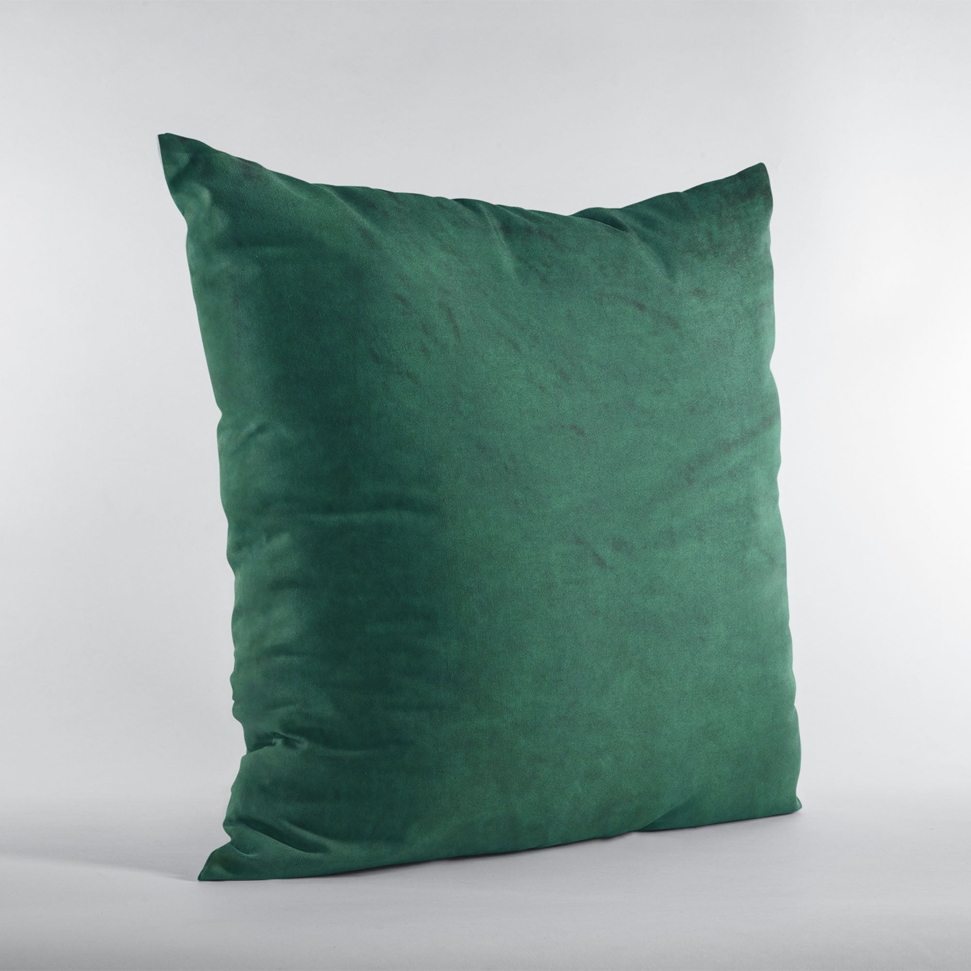 Plutus Emerald Lux Velvet Throw Pillow showcasing shiny emerald green velvet fabric with an invisible zipper and plush hypoallergenic insert.