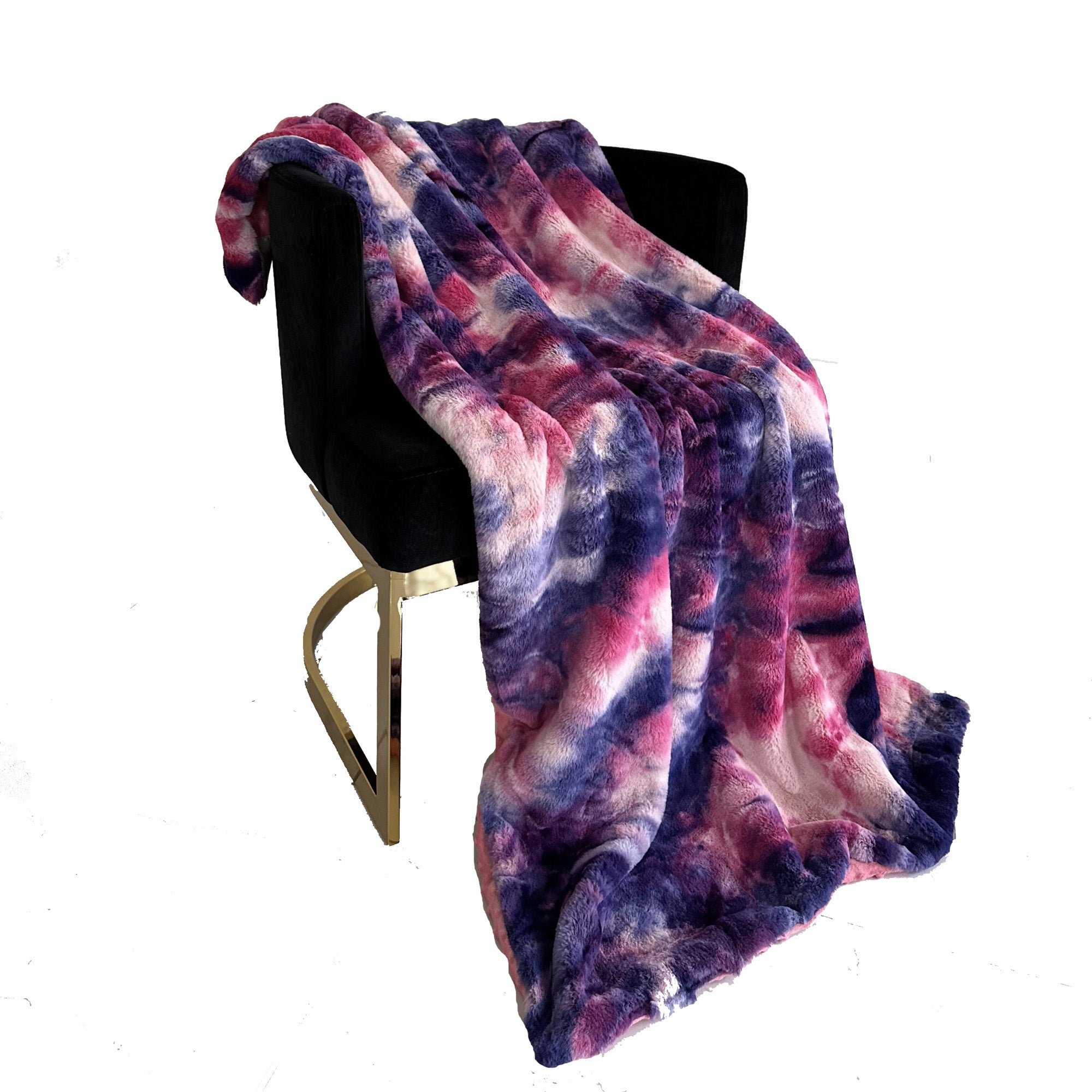 Plutus Fuchsia Purple Faux Fur Luxury Throw Blanket draped elegantly over a sofa, showcasing its plush texture and vibrant color.