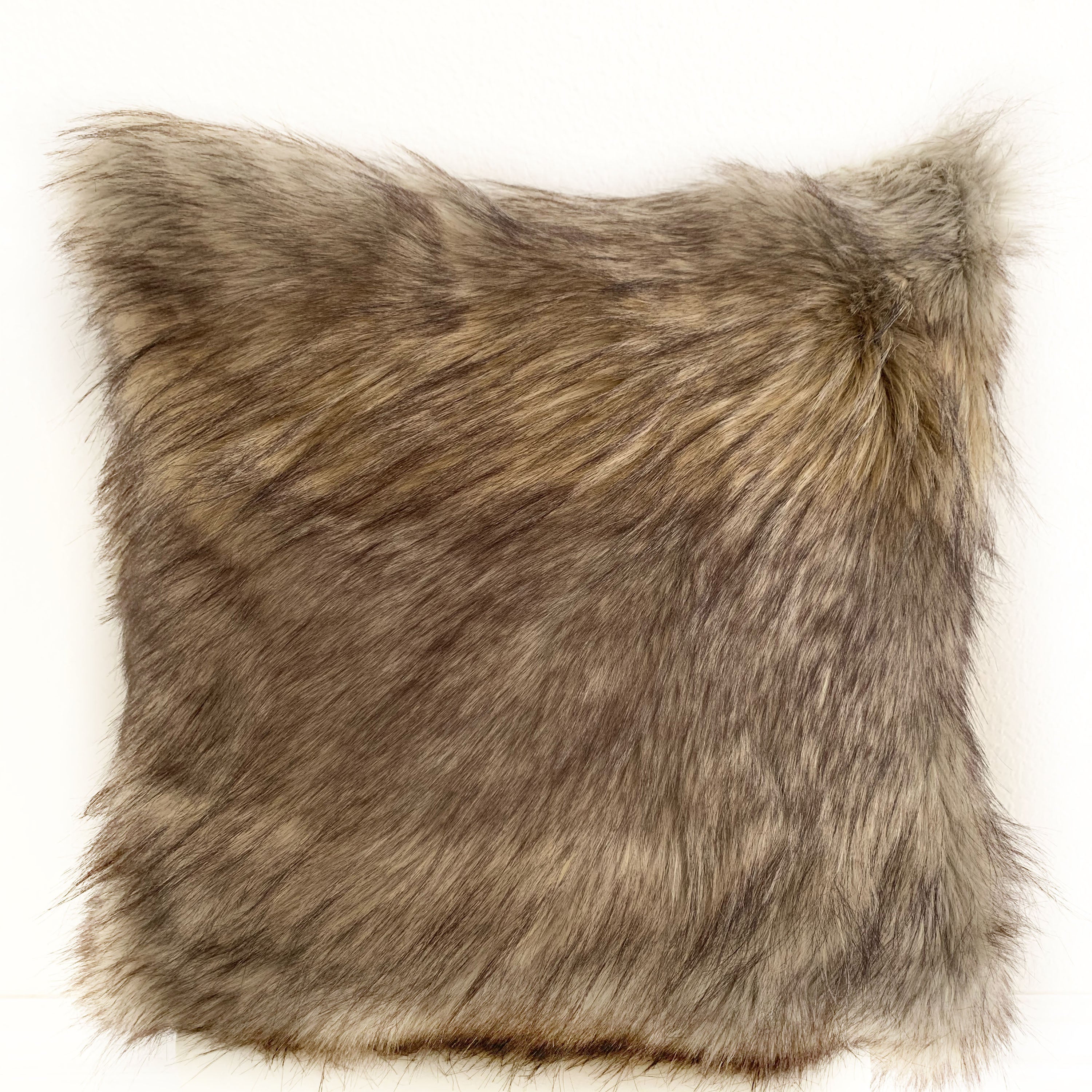 Plutus Gray Wolverine Pelage Animal Faux Fur Luxury Throw Pillow showcasing its luxurious gray faux fur texture and elegant design.