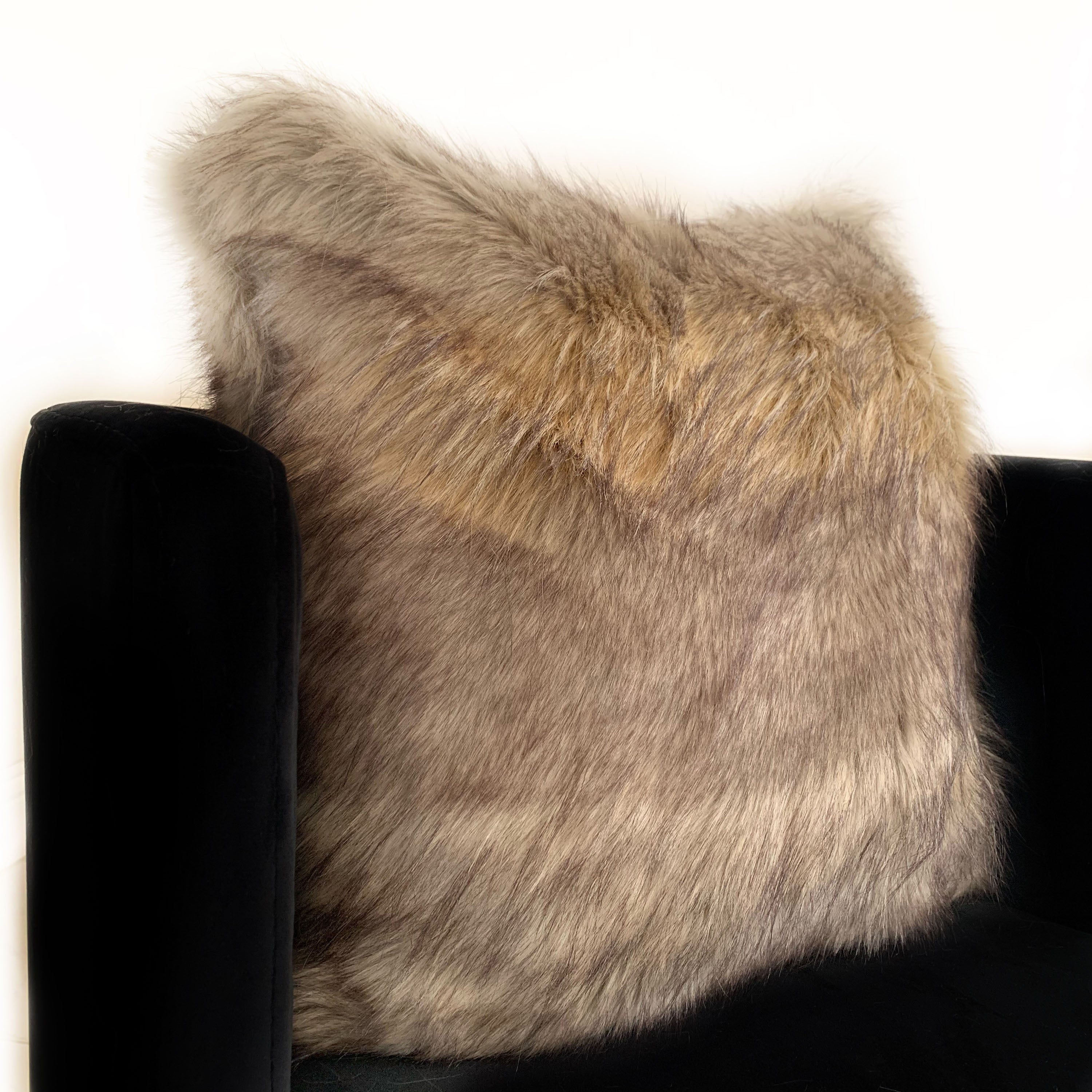 Plutus Gray Wolverine Pelage Animal Faux Fur Luxury Throw Pillow showcasing its luxurious gray faux fur texture and elegant design.