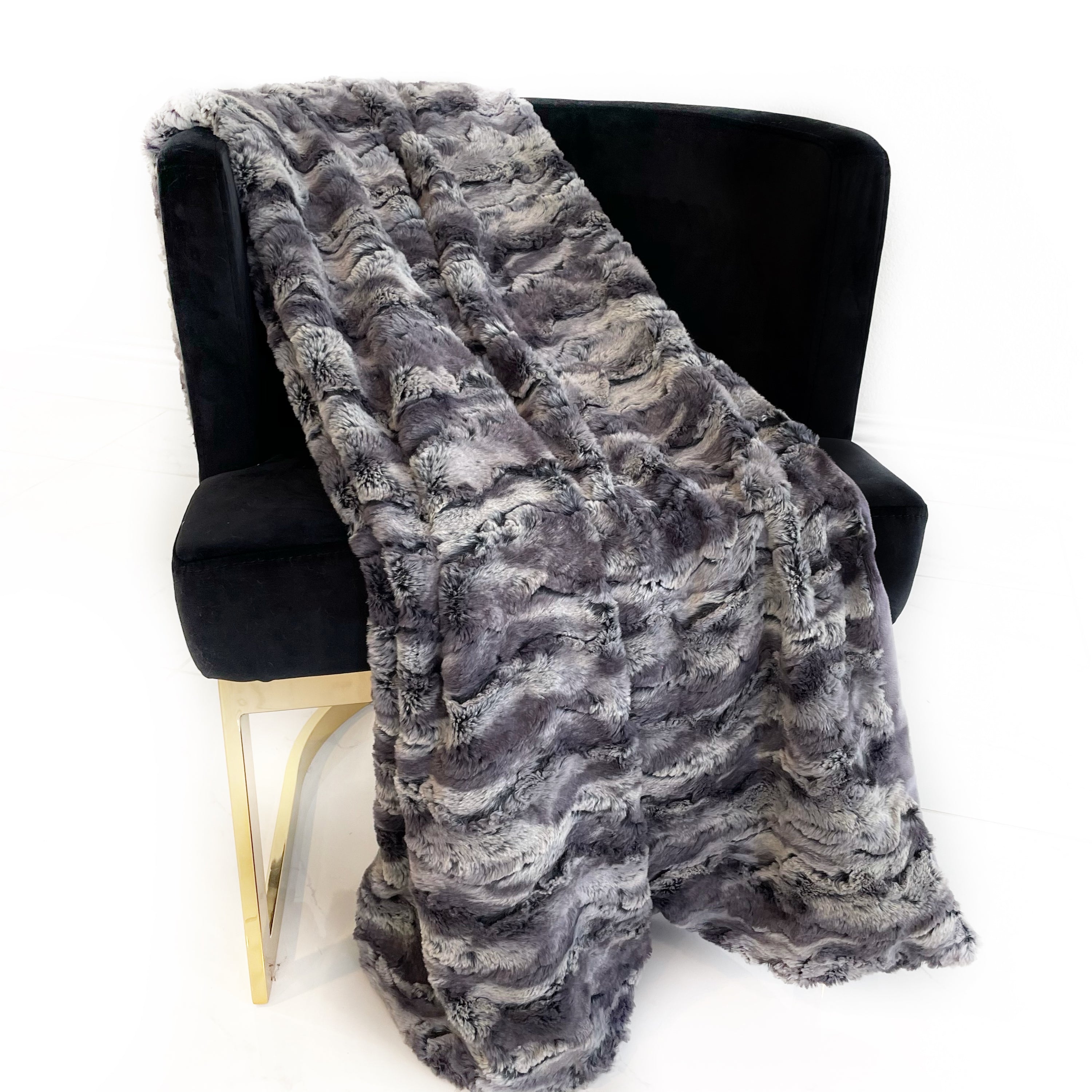 Plutus Metal Wild Rabbit Faux Fur Luxury Throw Blanket showcasing its plush texture and elegant metal color, perfect for home decor.