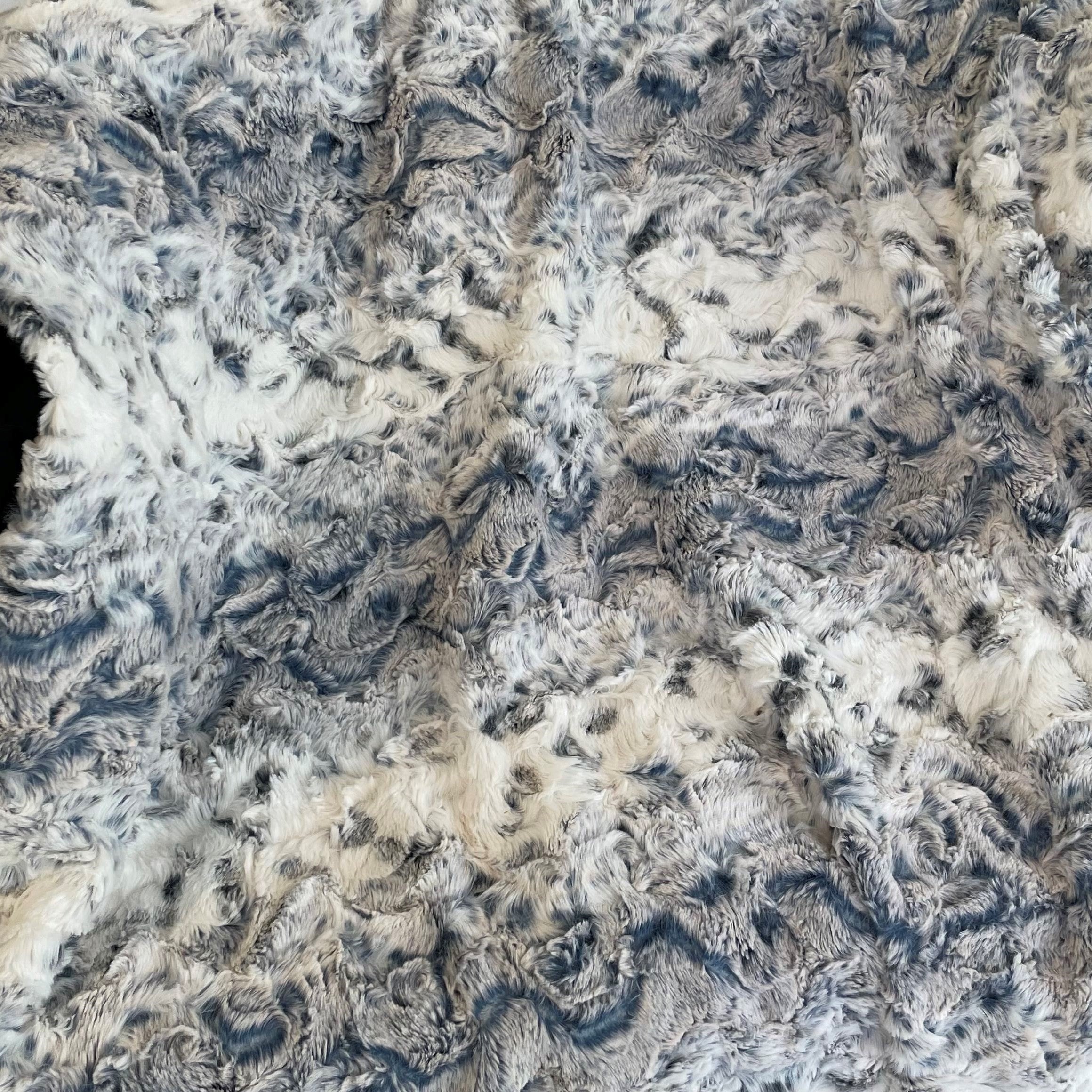 Plutus Navy Snowy Owl Faux Fur Luxury Throw Blanket showcasing its plush texture and reversible design in a stylish navy color.