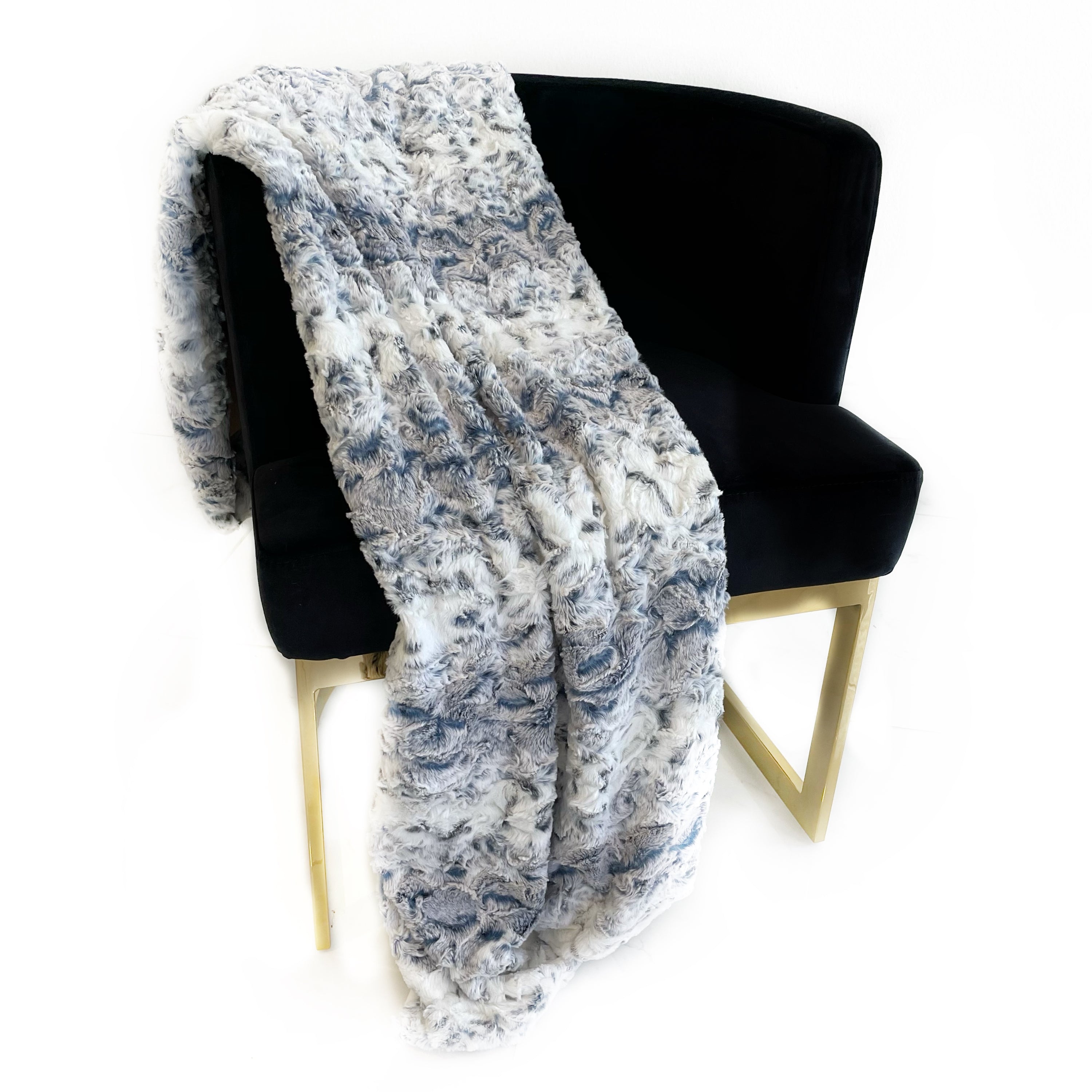 Plutus Navy Snowy Owl Faux Fur Luxury Throw Blanket showcasing its plush texture and reversible design in a stylish navy color.