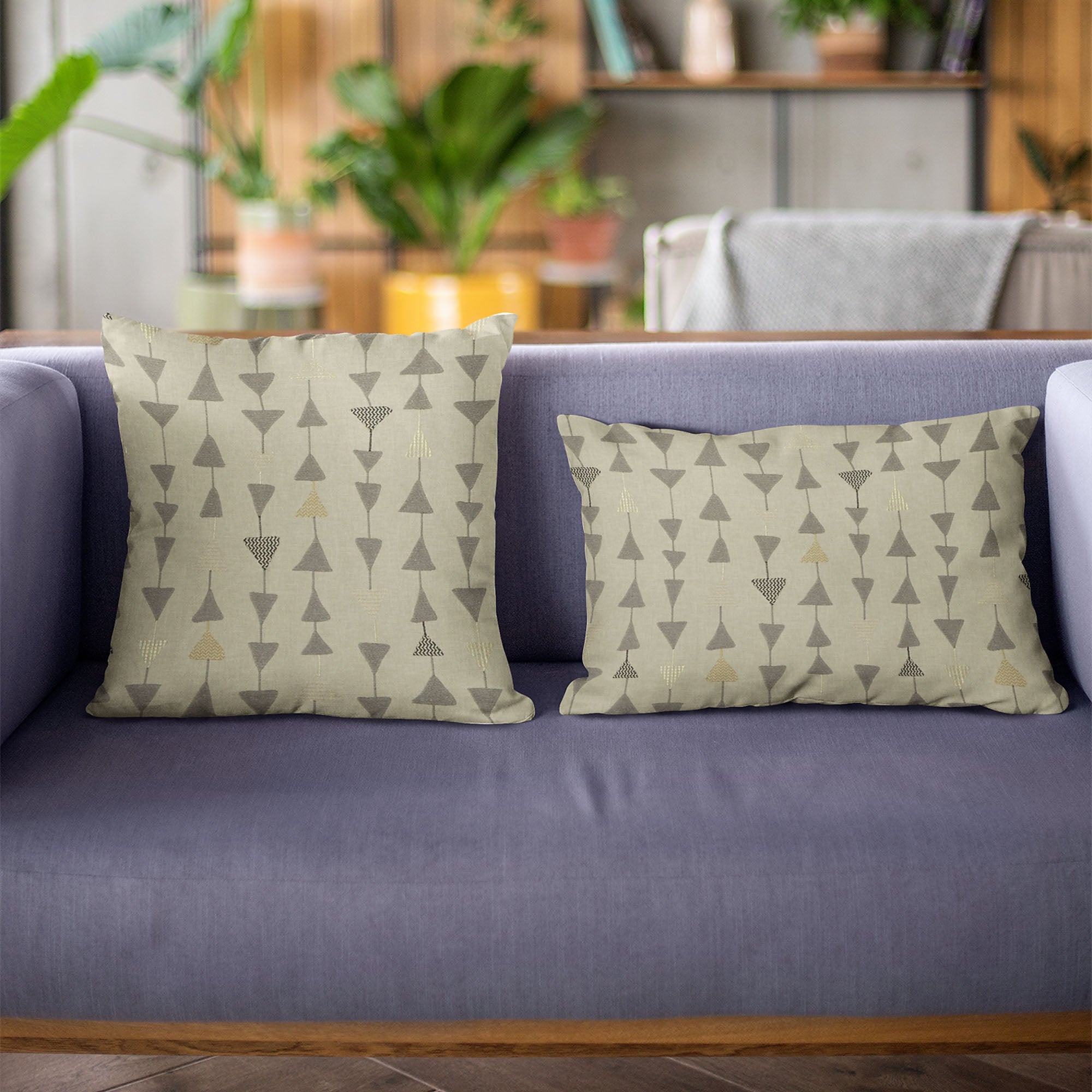 Plutus Pebble Manti Embroidery throw pillow featuring metallic triangle accents, showcasing luxurious fabric and elegant design.