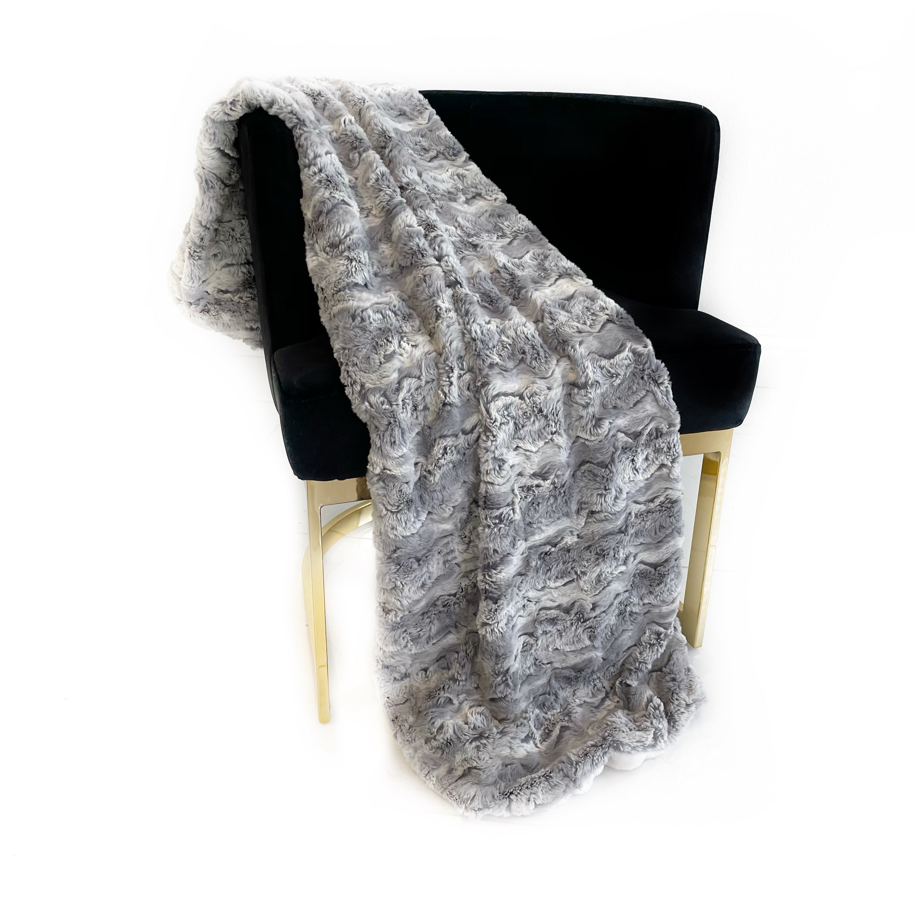 Plutus Silver Wild Rabbit Faux Fur Luxury Throw Blanket showcasing its soft texture and elegant silver color, perfect for stylish home decor.