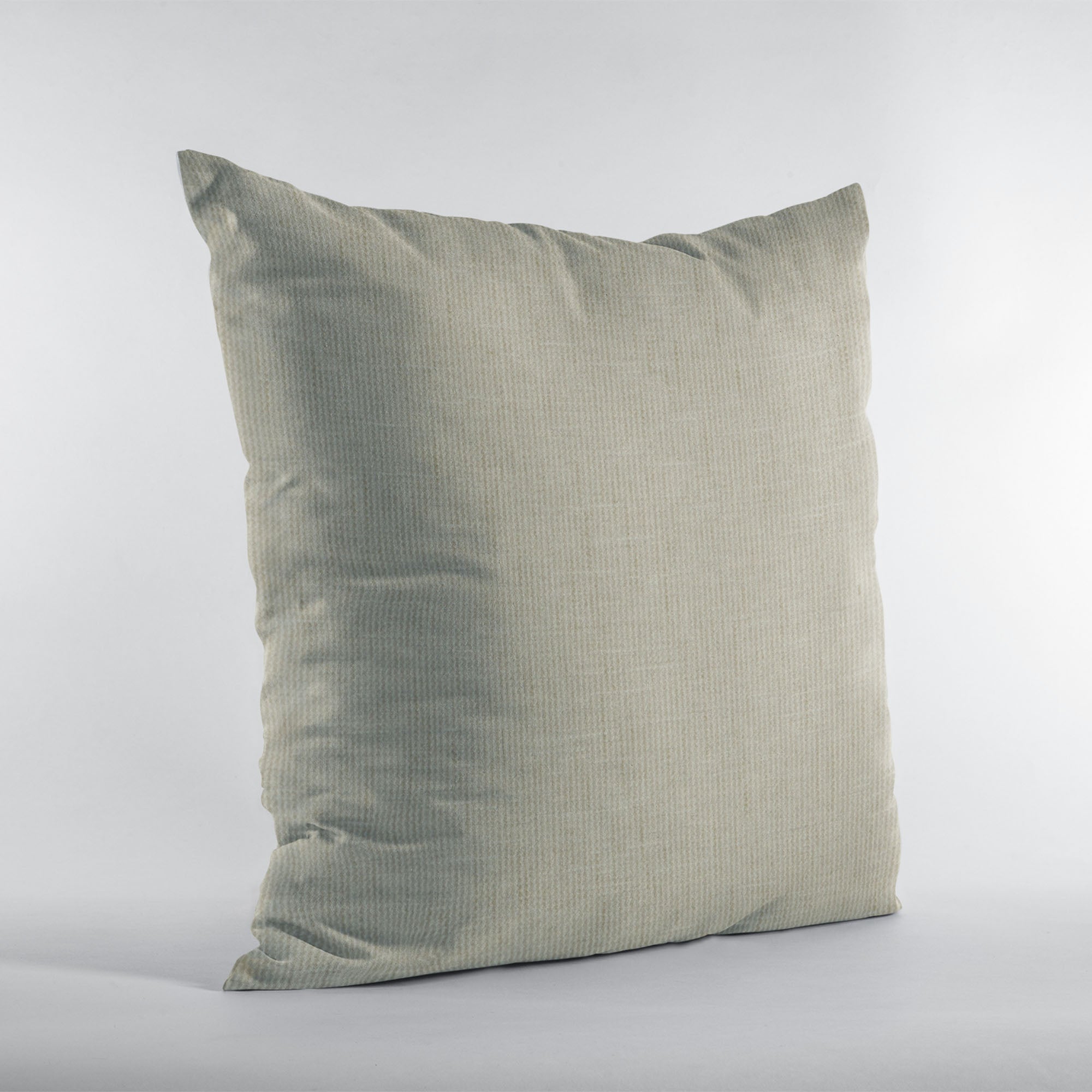 Plutus Stonewash Waffle Textured Solid throw pillow showcasing a luxurious waffle texture in a stonewash color, featuring an invisible zipper and professional stitching.