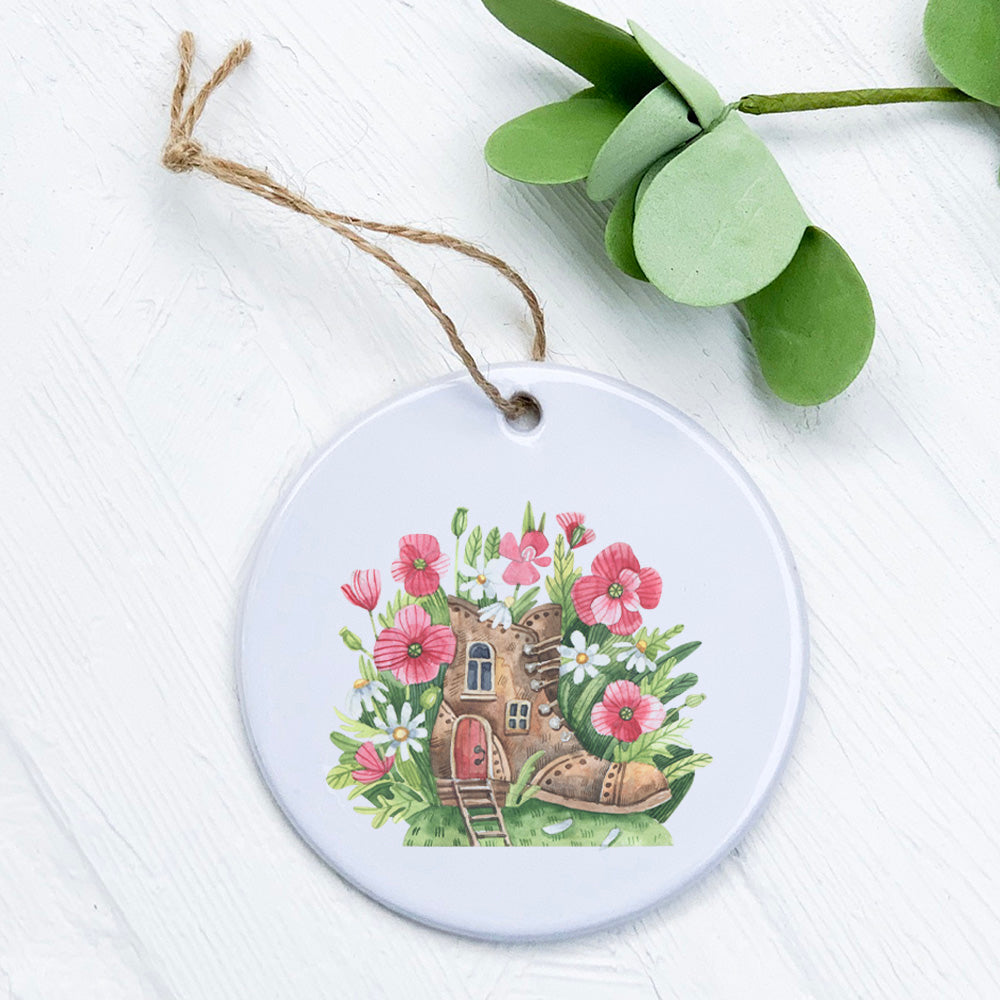 A beautifully crafted Poppy Boot Fairy House ornament made of high-quality porcelain, featuring vibrant colors and a glossy finish.