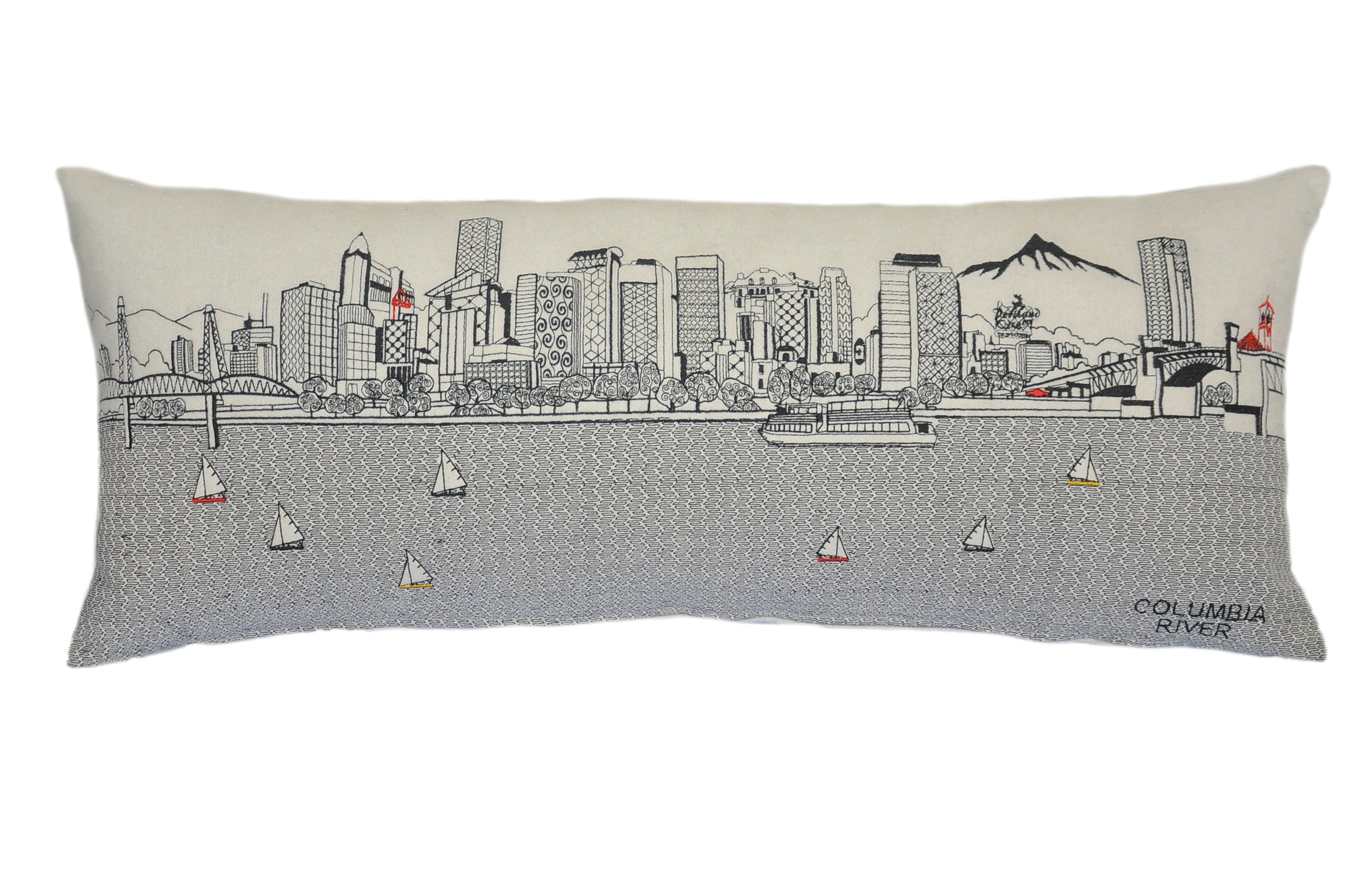 Portland Pillow featuring embroidered designs of iconic Portland landmarks and bridges, with a red zipper at the bottom.