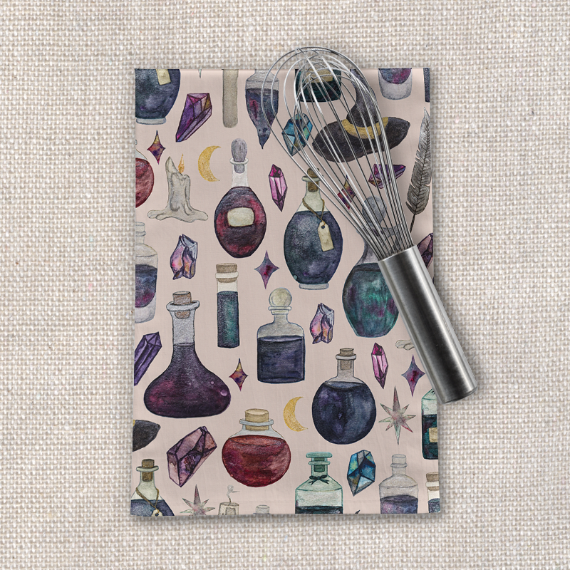 A colorful Potions Pattern Tea Towel made of cotton twill, featuring whimsical potion designs, perfect for kitchen use and decoration.