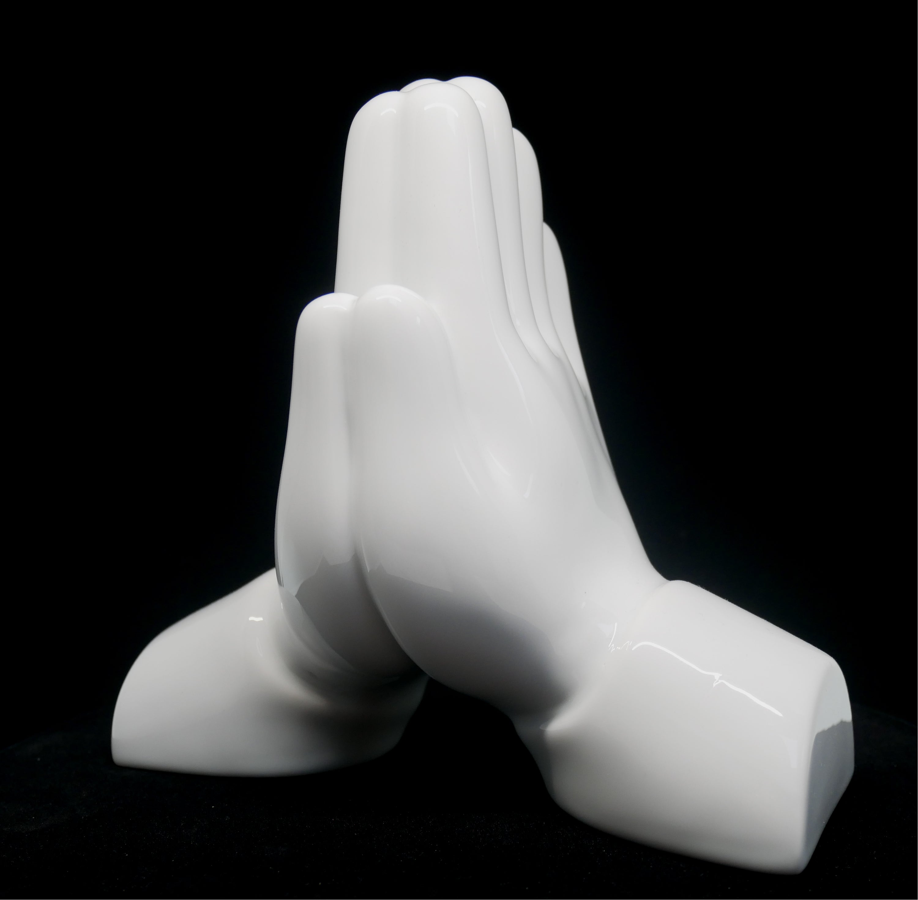 Pray Hands Porcelain sculpture by Matthew Lapenta, crafted from extra white porcelain with a black finish, symbolizing respect and gratitude.