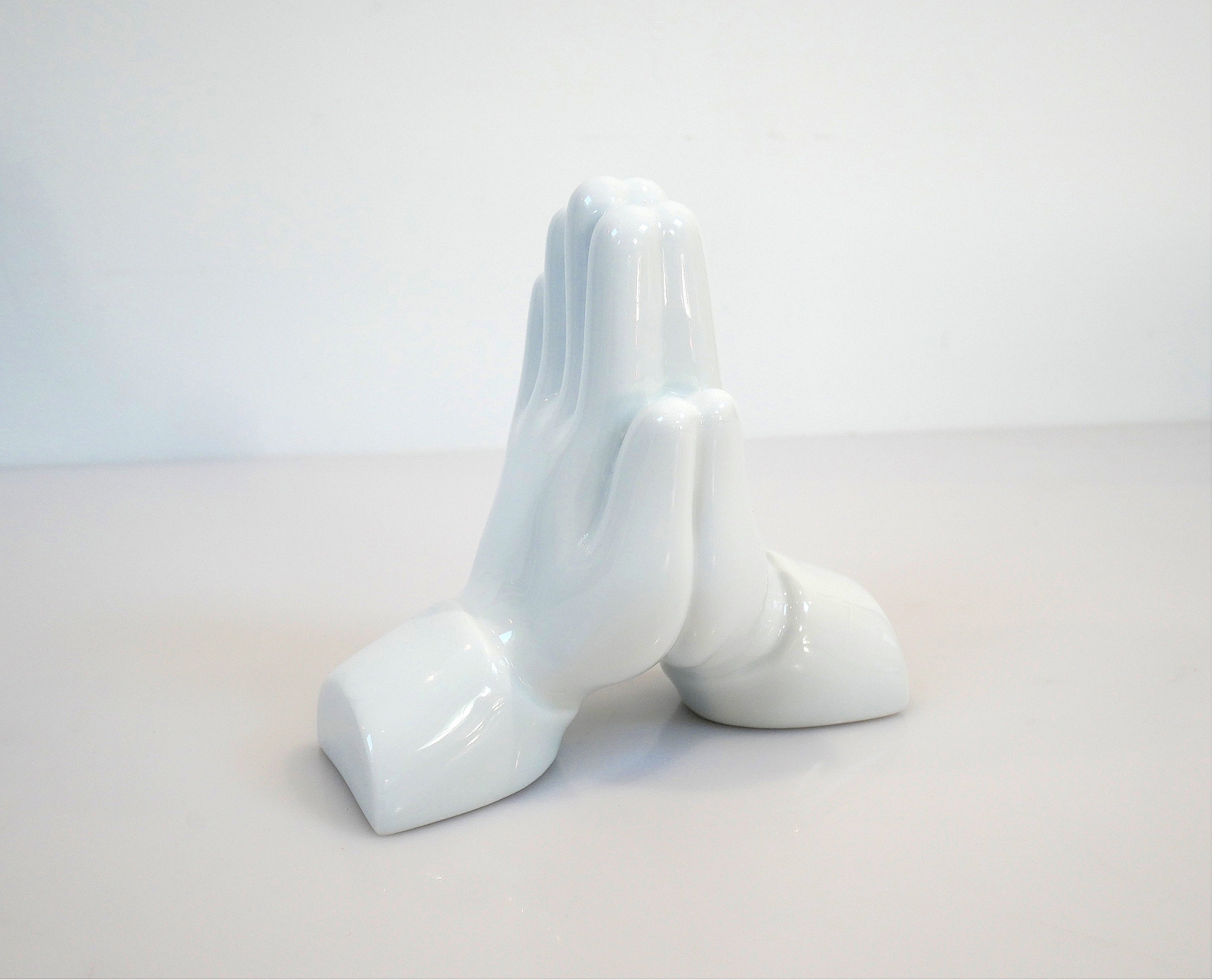 Pray Hands Porcelain sculpture by Matthew Lapenta, crafted from extra white porcelain with a black finish, symbolizing respect and gratitude.