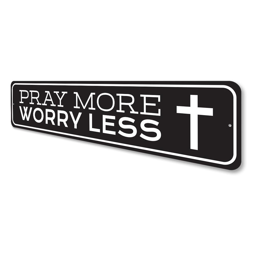 A decorative Pray More Worry Less sign made of durable aluminum, featuring a stylish design suitable for home decor.