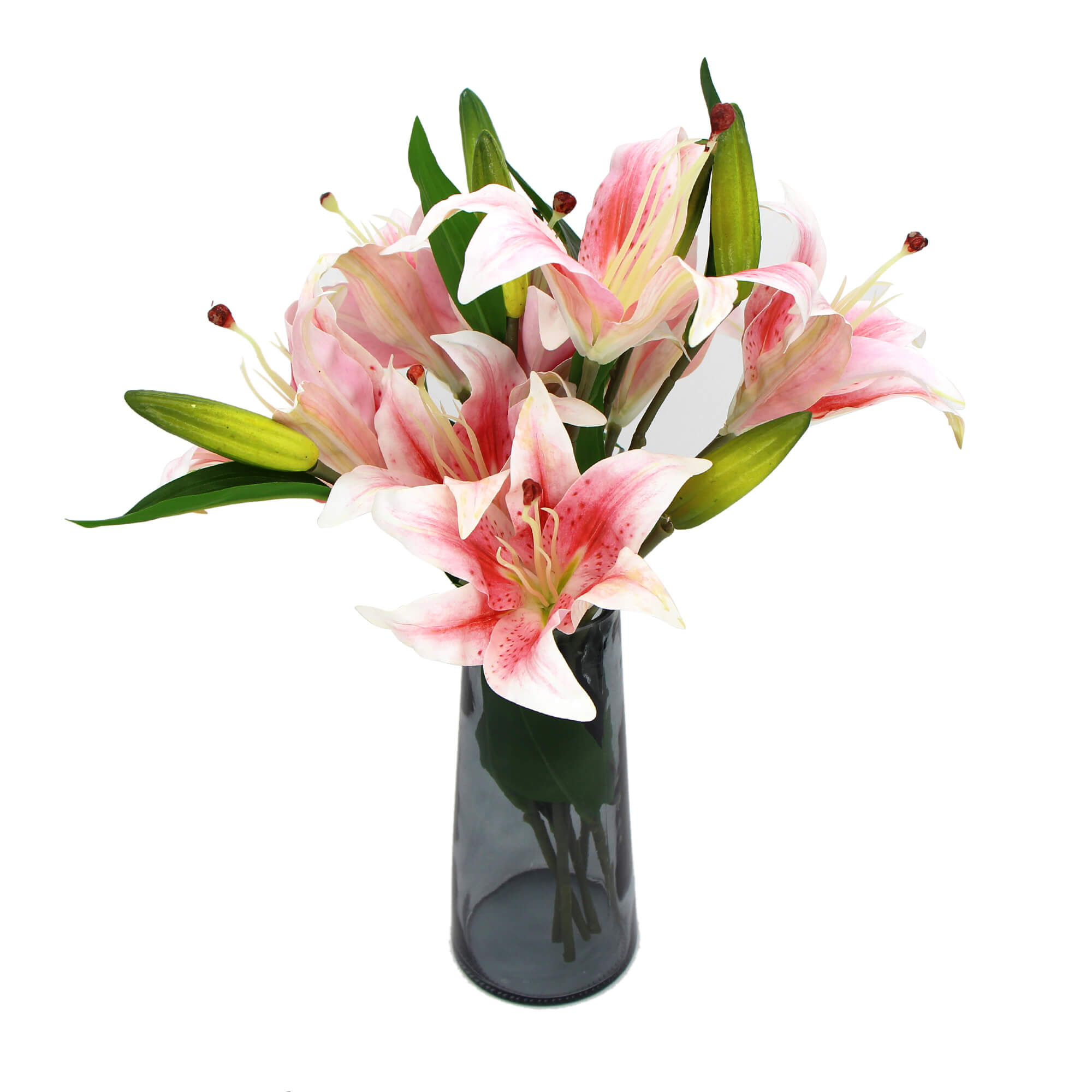 A beautiful arrangement of premium faux pink lilies in a clear glass vase, showcasing realistic flowers and foliage.