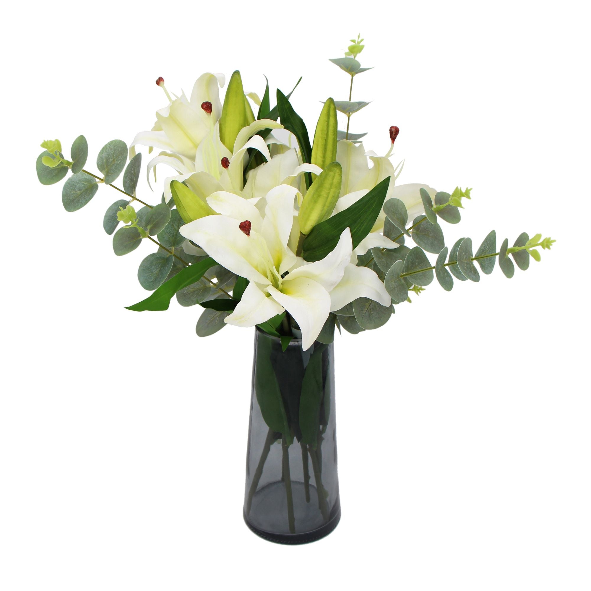 A beautiful arrangement of premium faux white lilies in a stylish glass vase, showcasing realistic petals and lush eucalyptus stems.