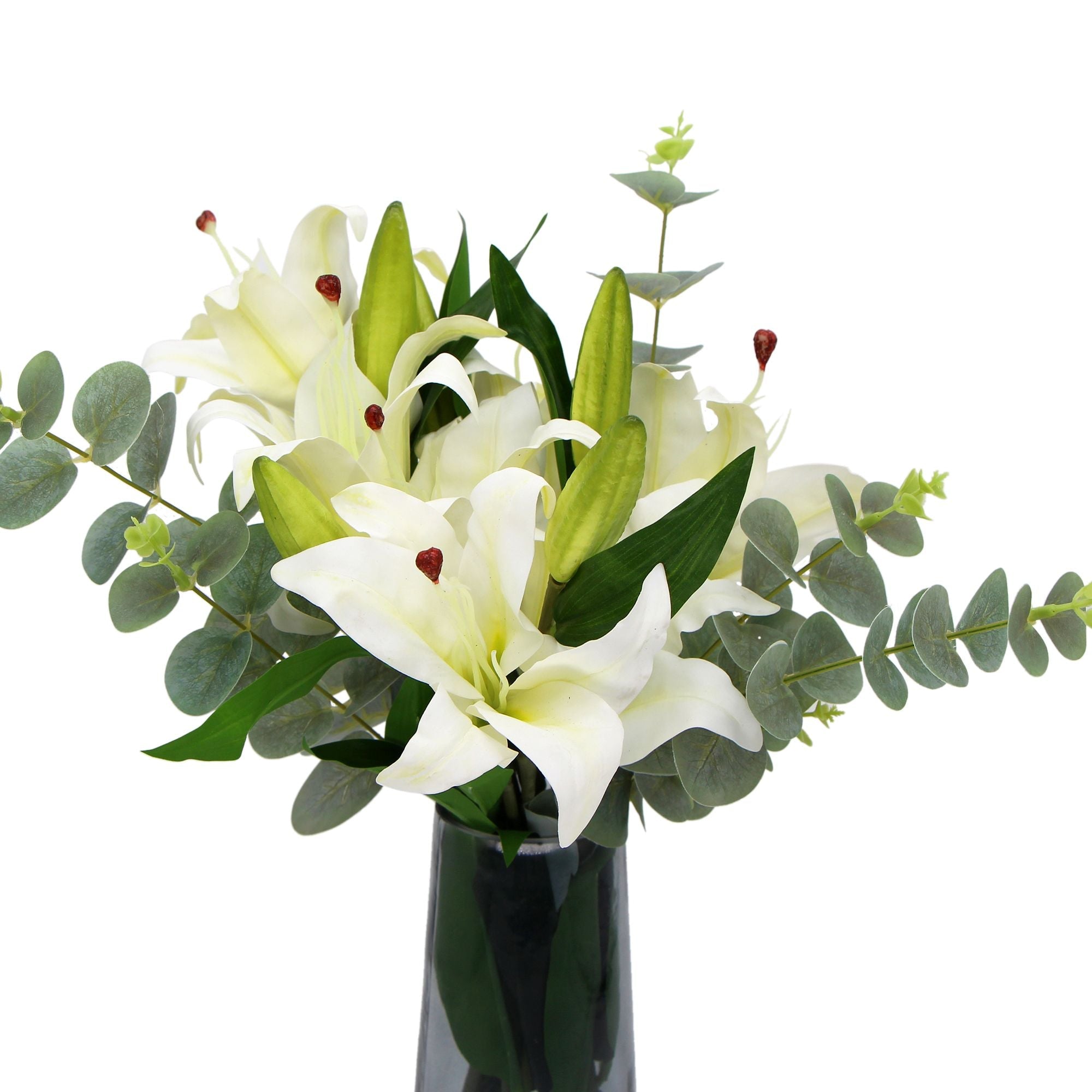 A beautiful arrangement of premium faux white lilies in a stylish glass vase, showcasing realistic petals and lush eucalyptus stems.