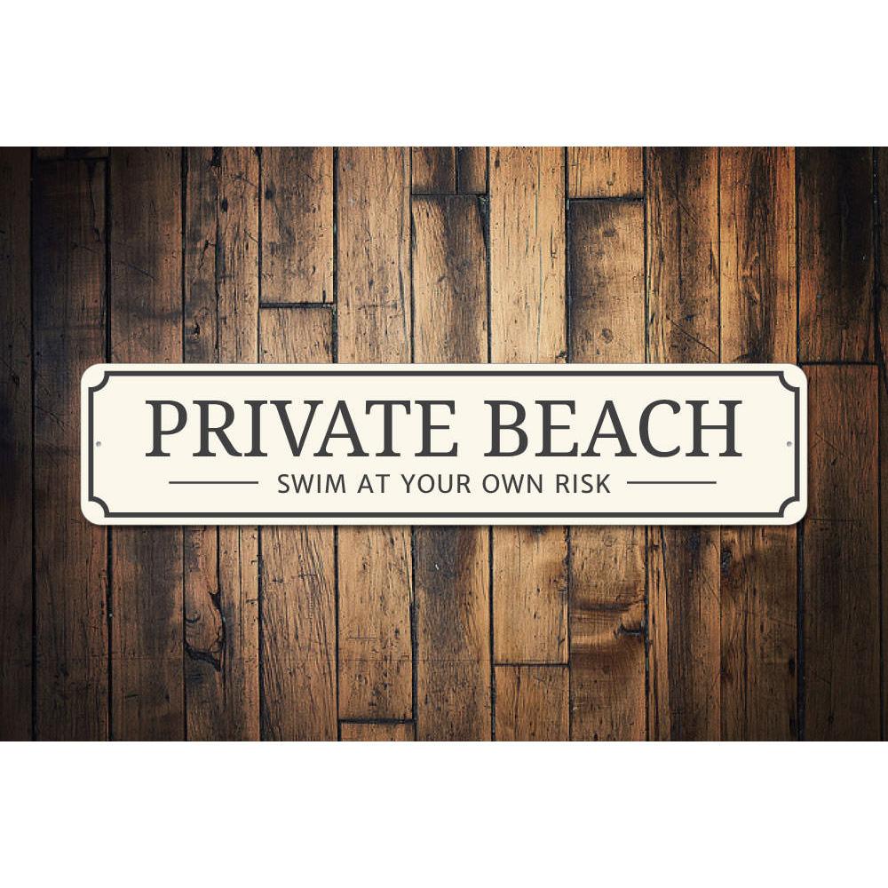 A decorative Private Beach Entrance Sign made of durable aluminum, featuring customizable text and pre-drilled holes for easy mounting.