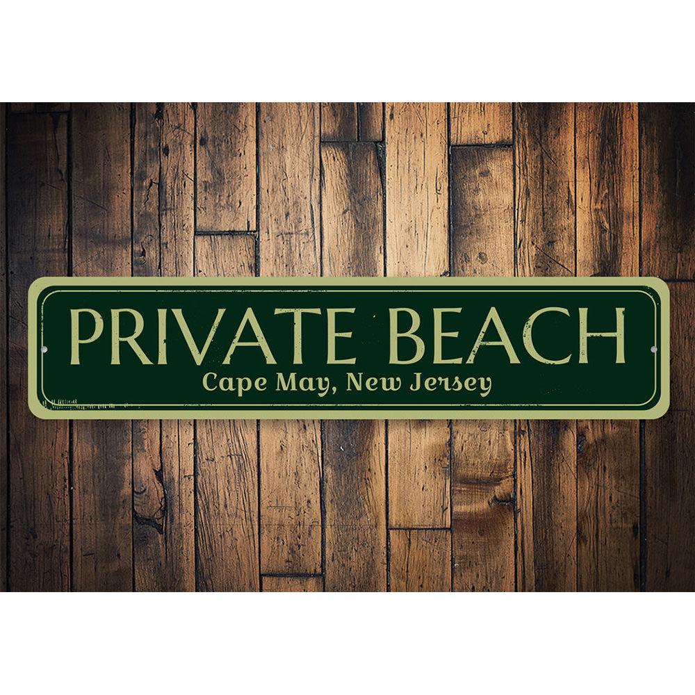 A decorative Private Beach Location Sign made of high-quality aluminum, featuring customizable text and pre-drilled holes for easy mounting.