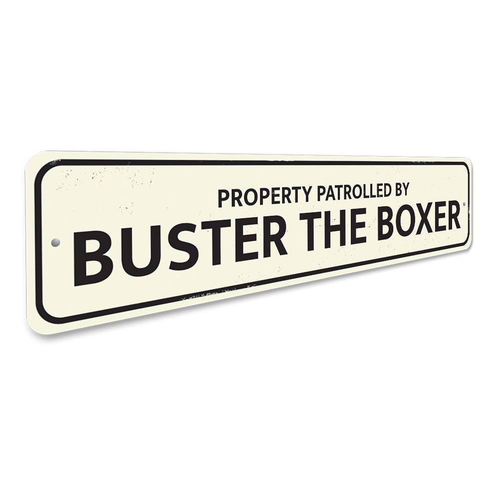 Property Patrolled by Pet Sign made of durable aluminum, featuring customizable text and pre-drilled holes for easy mounting.