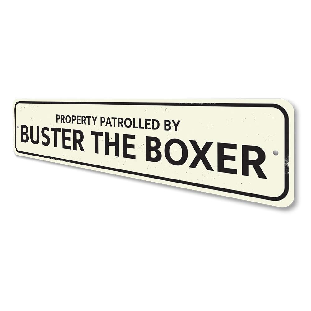 Property Patrolled by Pet Sign made of durable aluminum, featuring customizable text and pre-drilled holes for easy mounting.