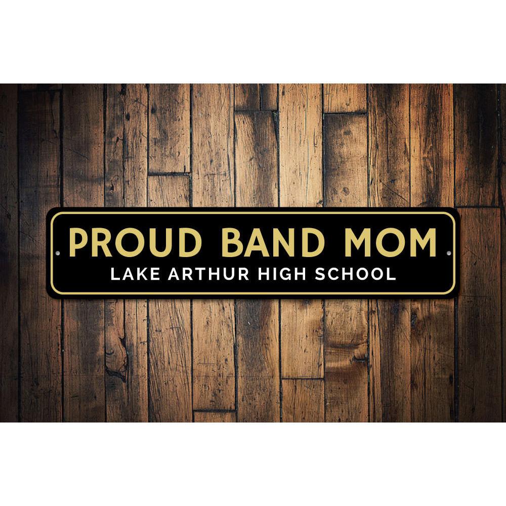 A decorative Proud Band Mom Sign made of high-quality aluminum, featuring vibrant colors and customizable text, perfect for home decor.