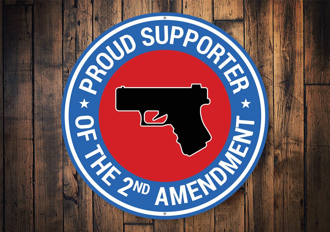 A decorative metal sign displaying the text 'Proud Supporter of the 2nd Amendment', featuring a stylish design suitable for home decor.