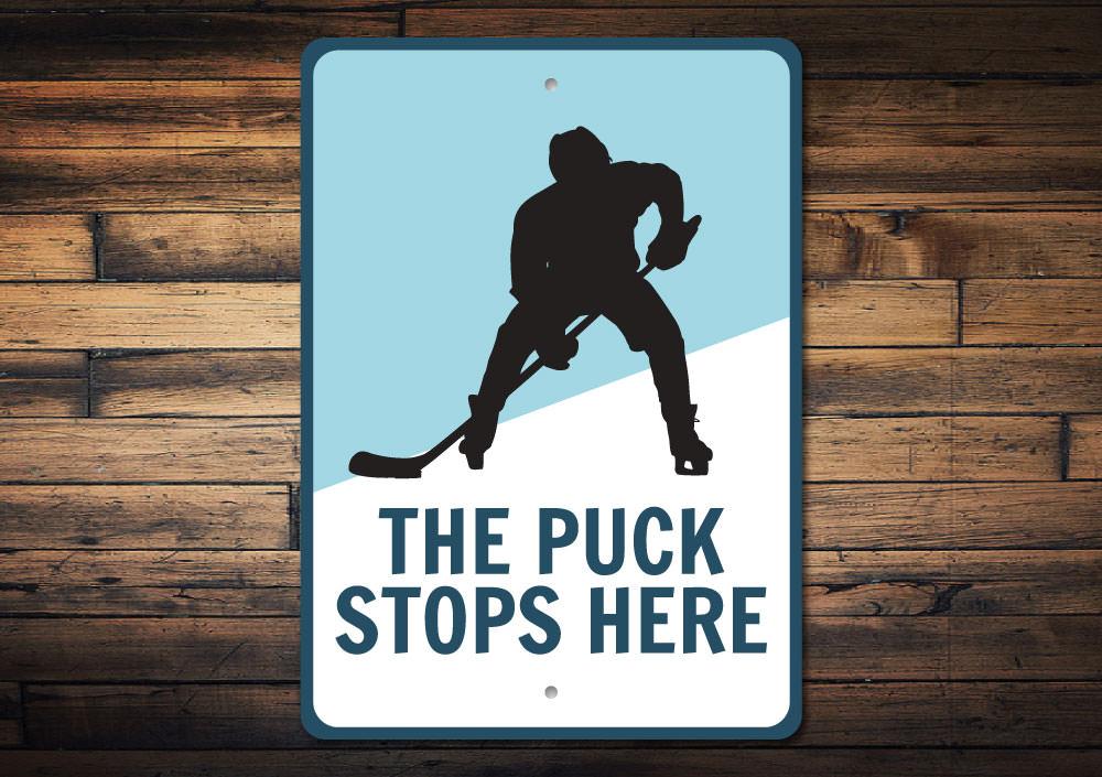 Puck Stops Here Sign made of durable aluminum, featuring a stylish design perfect for home decor.