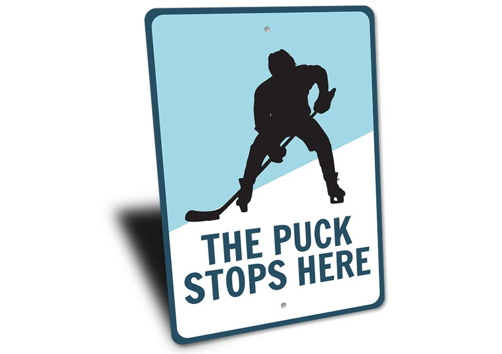 Puck Stops Here Sign made of durable aluminum, featuring a stylish design perfect for home decor.