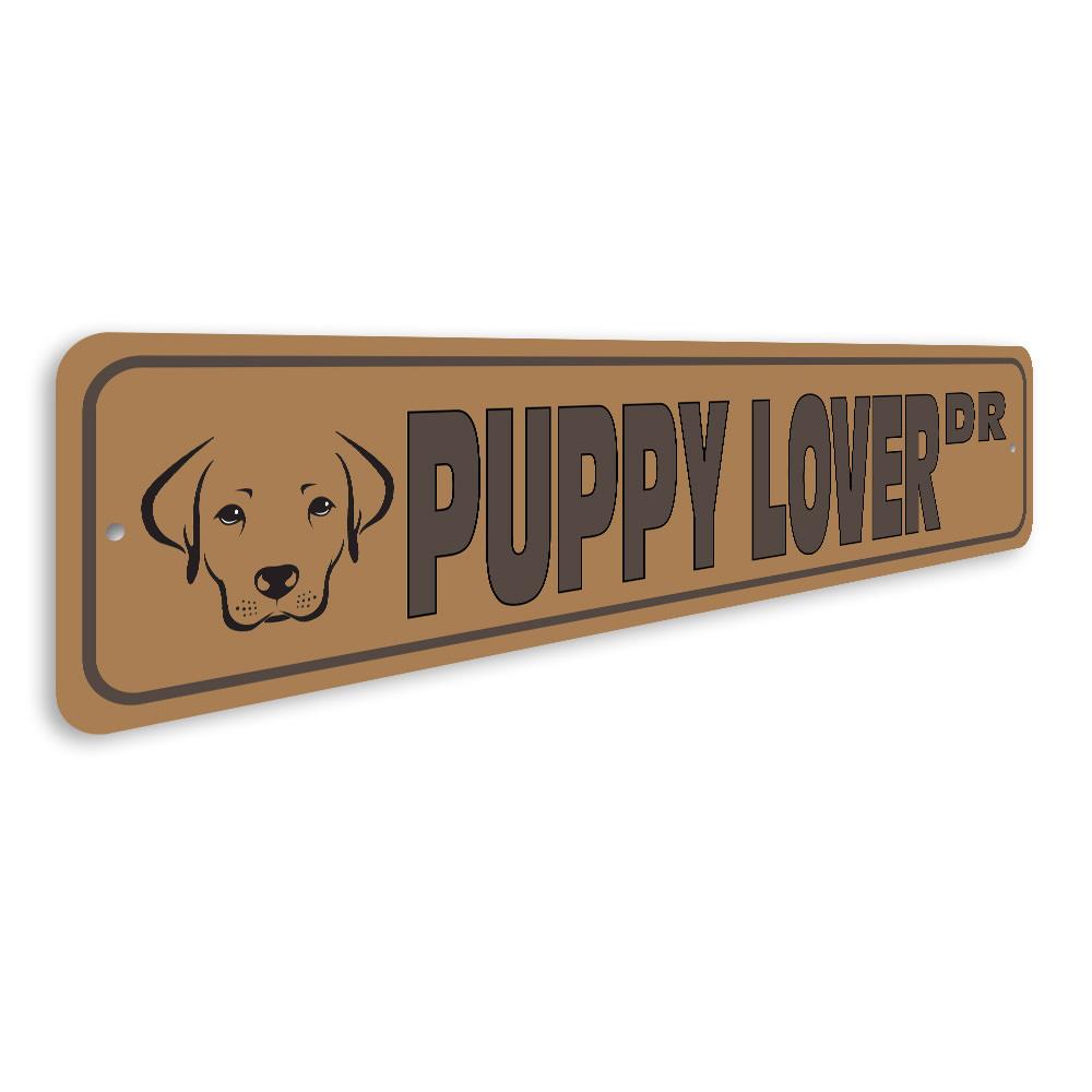 A colorful Puppy Street Sign made of durable aluminum, featuring a playful dog design, perfect for home decor.